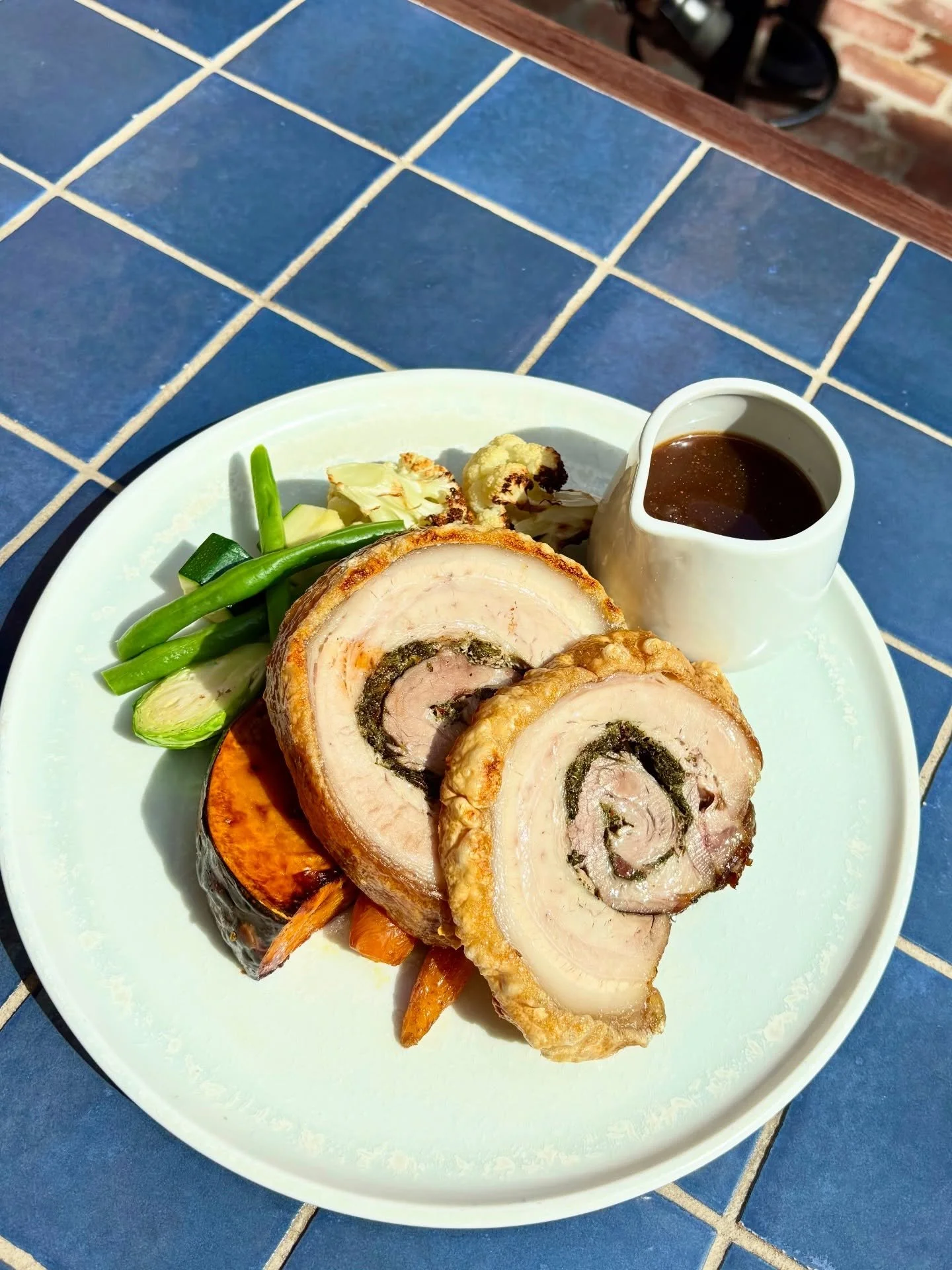 Sunday roast is up!

You know and love our beef brisket, but have you tried the newest addition to our Sunday lineup, our Roast Porchetta?

We&rsquo;ll bring you a plate piled with our roasted porchetta, roast potatoes and pumpkin, greens, carrots, c