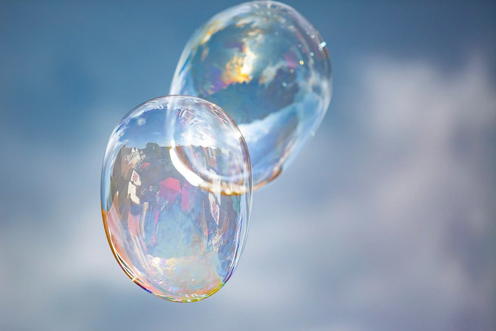 Two huge bubbles flying together