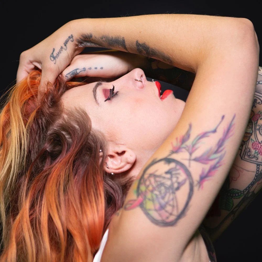 Tattooed model poses for portfolio image