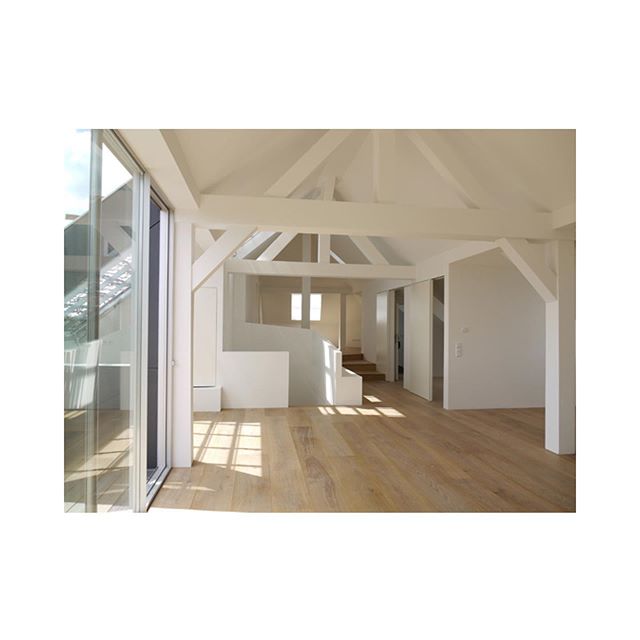 The conversion of an attic space into a open-plan loft apartment in Munich. Swipe to see the transformation.