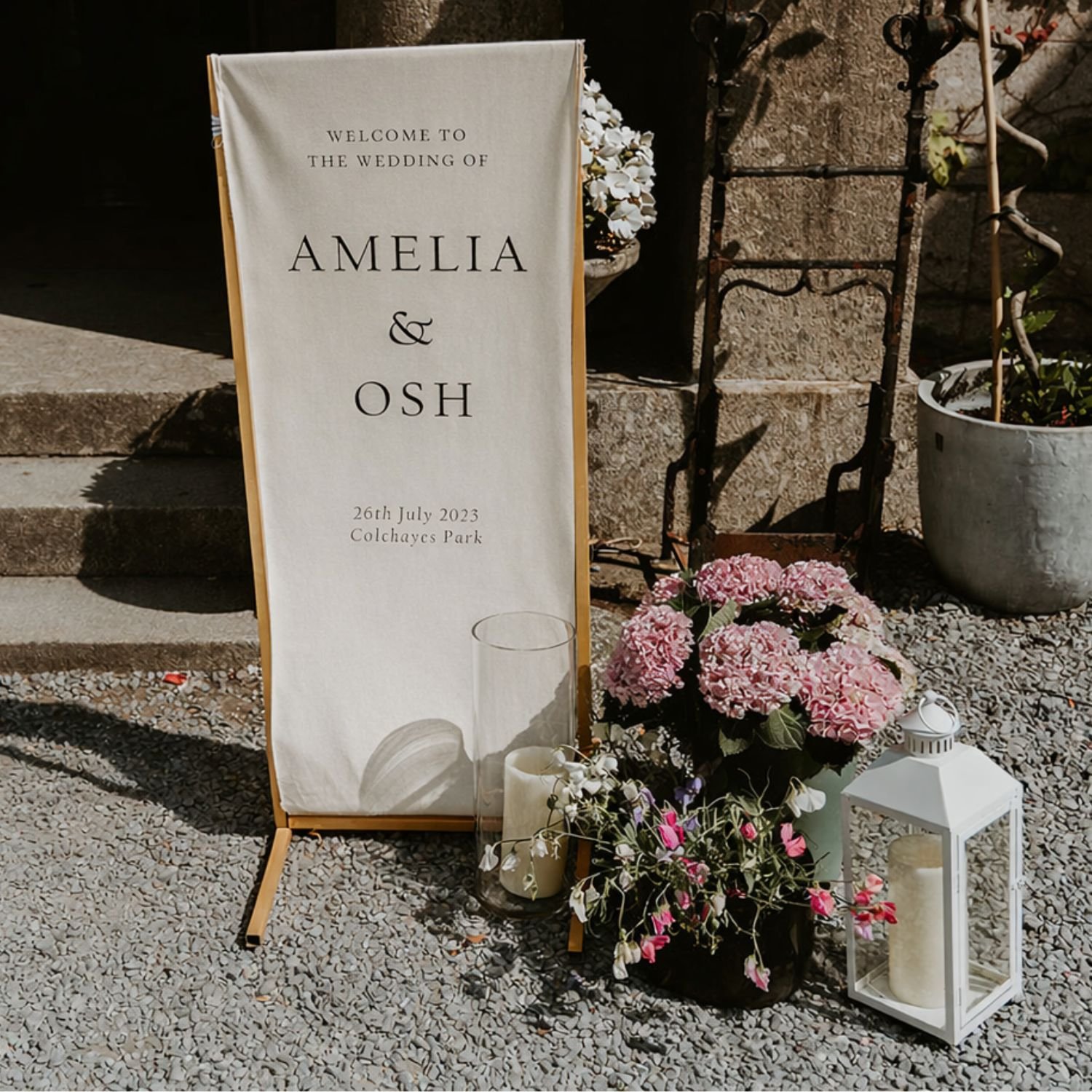 gold-metal-stand-with-wedding-welcome-sign