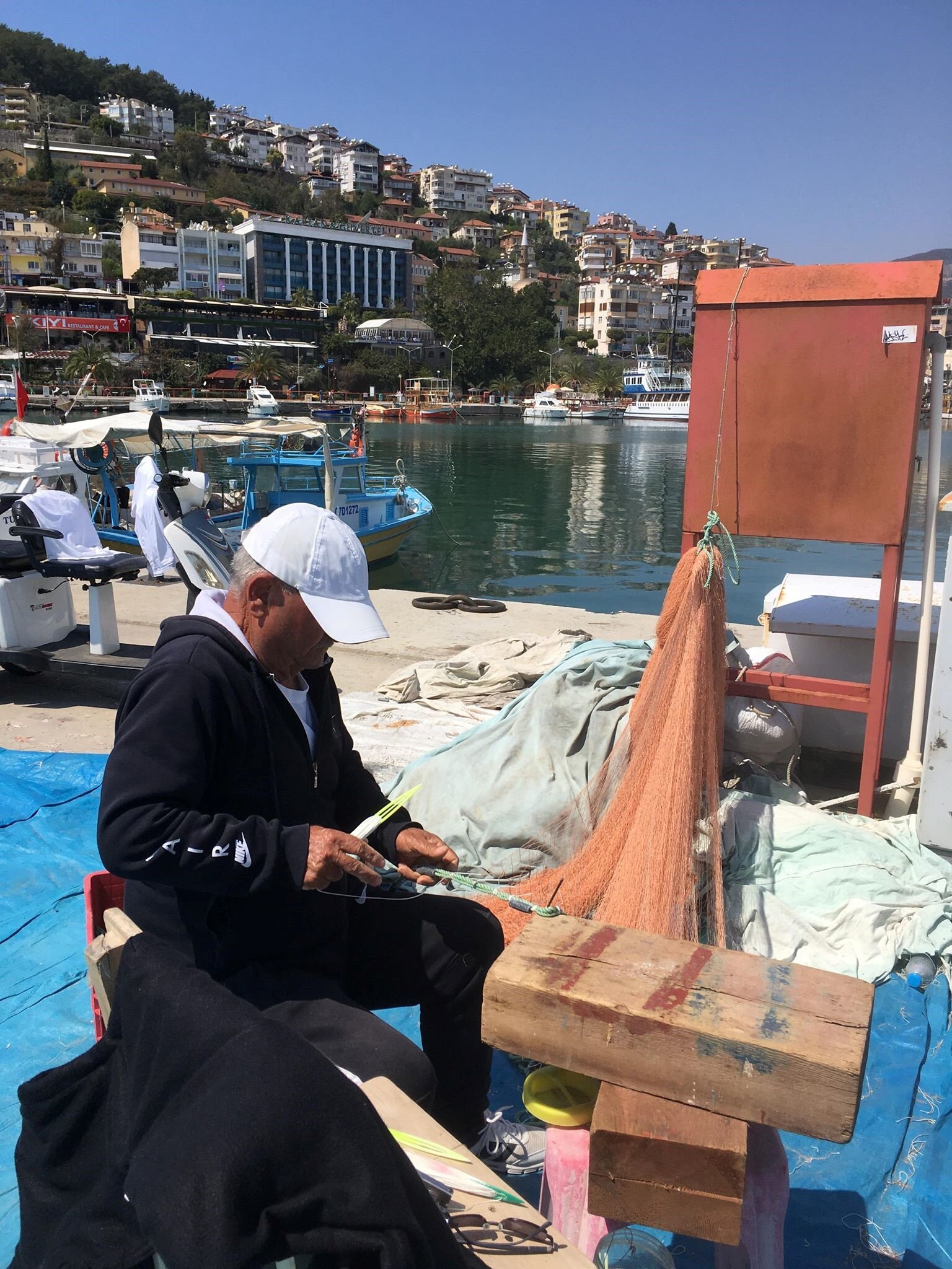 Figure 9.2 A Fisherman Repairinf his Fishing Gear During the Off-Season.jpg