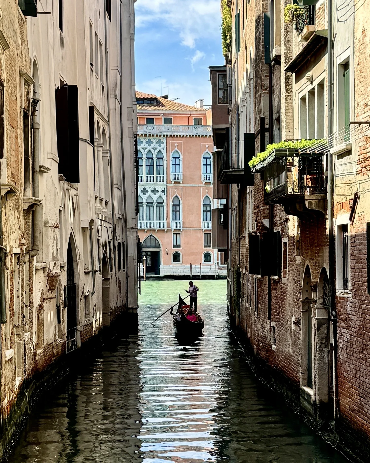 A gondola ride through Venice's canals filled with art enthusiasts