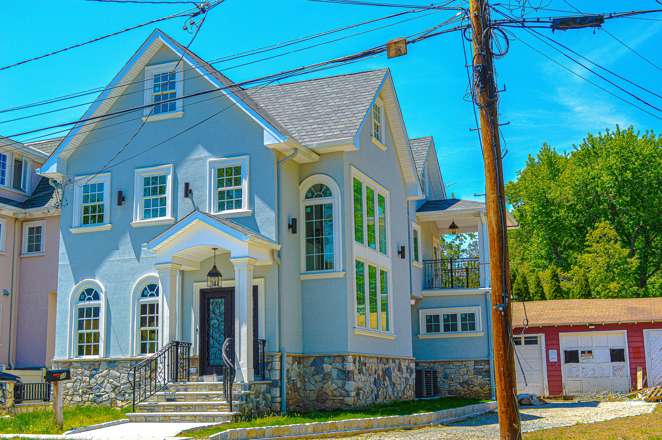 Big Blue House with a Red Garage