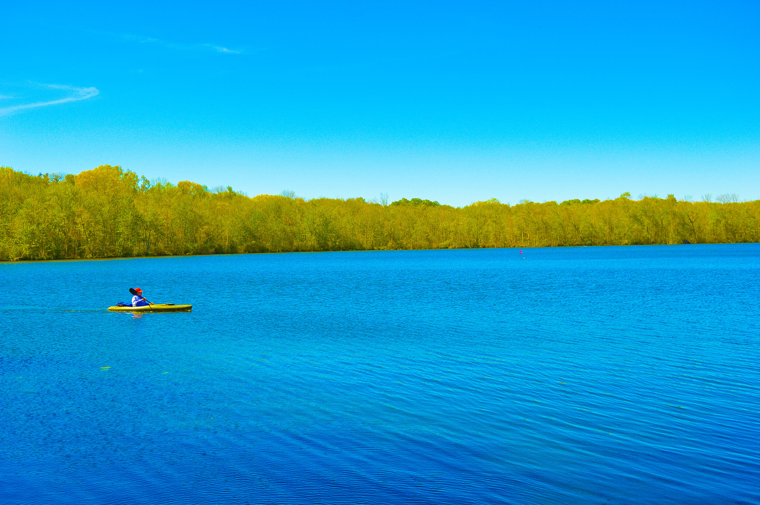 Canoe Man on Blue Lake