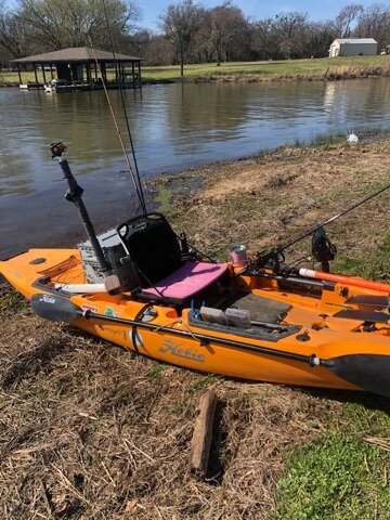 Cher Mango Hobie with pink kushion river.jpg