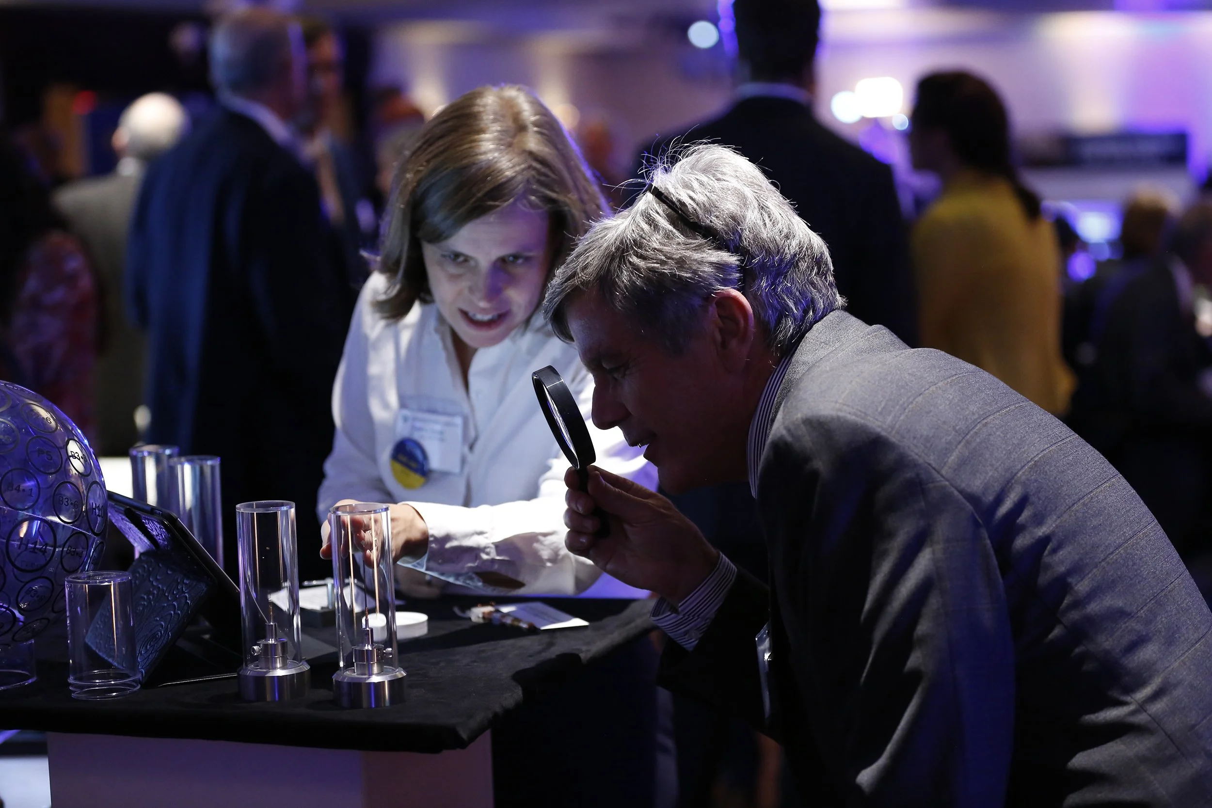  Tanya Kosc, a scientist at the Laboratory for Laser Energetics, shows a guest some of the technologies used at the Center for Advanced High Power Laser Research. 