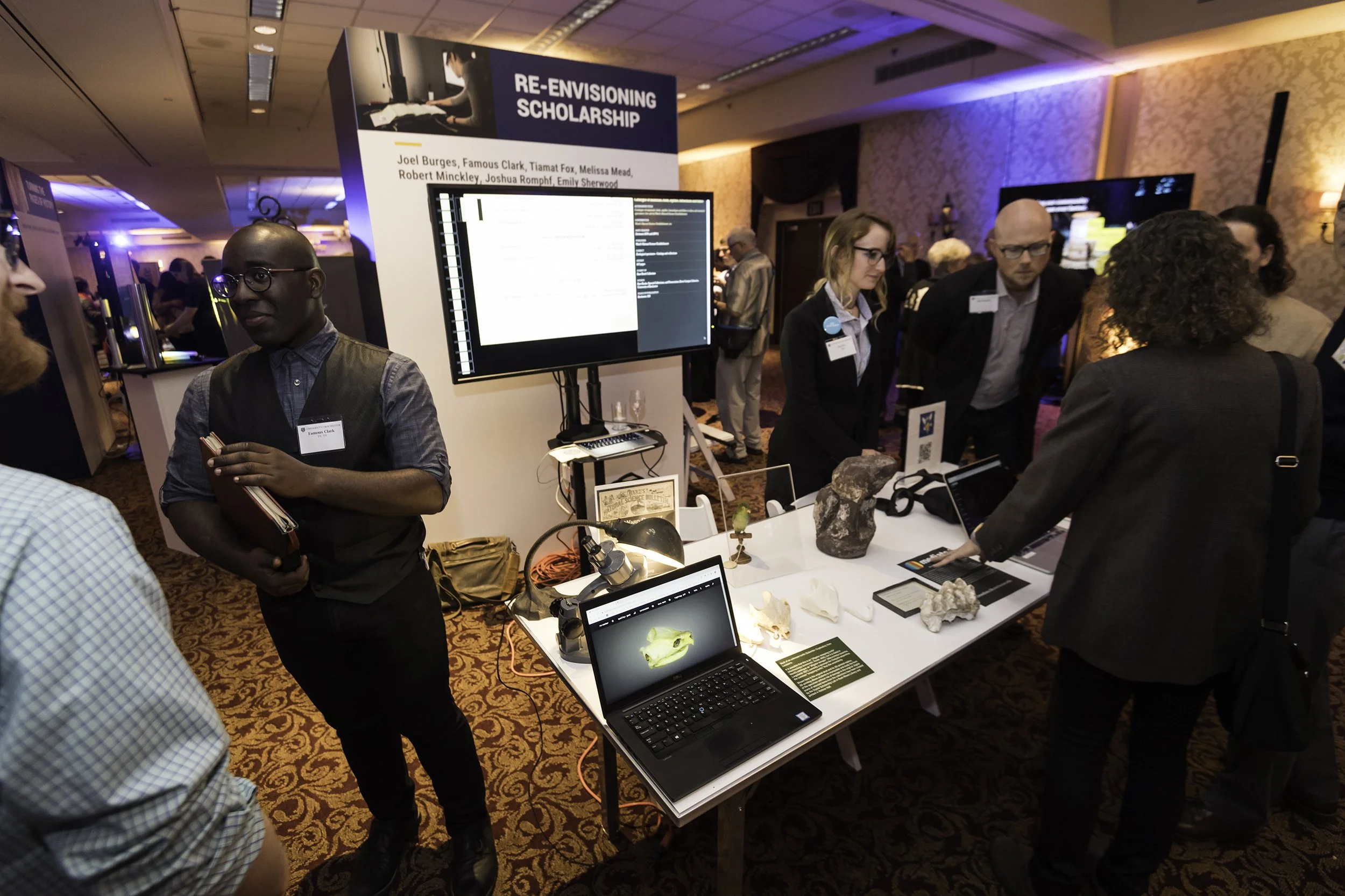  Guests mingle with faculty and students at the Rochester Riverside Convention Center. 