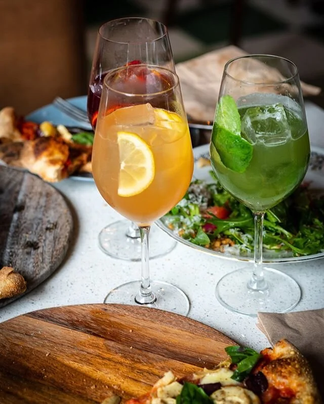 Sips, slices, salads, and smiles are the fabric of Sunday sessions.