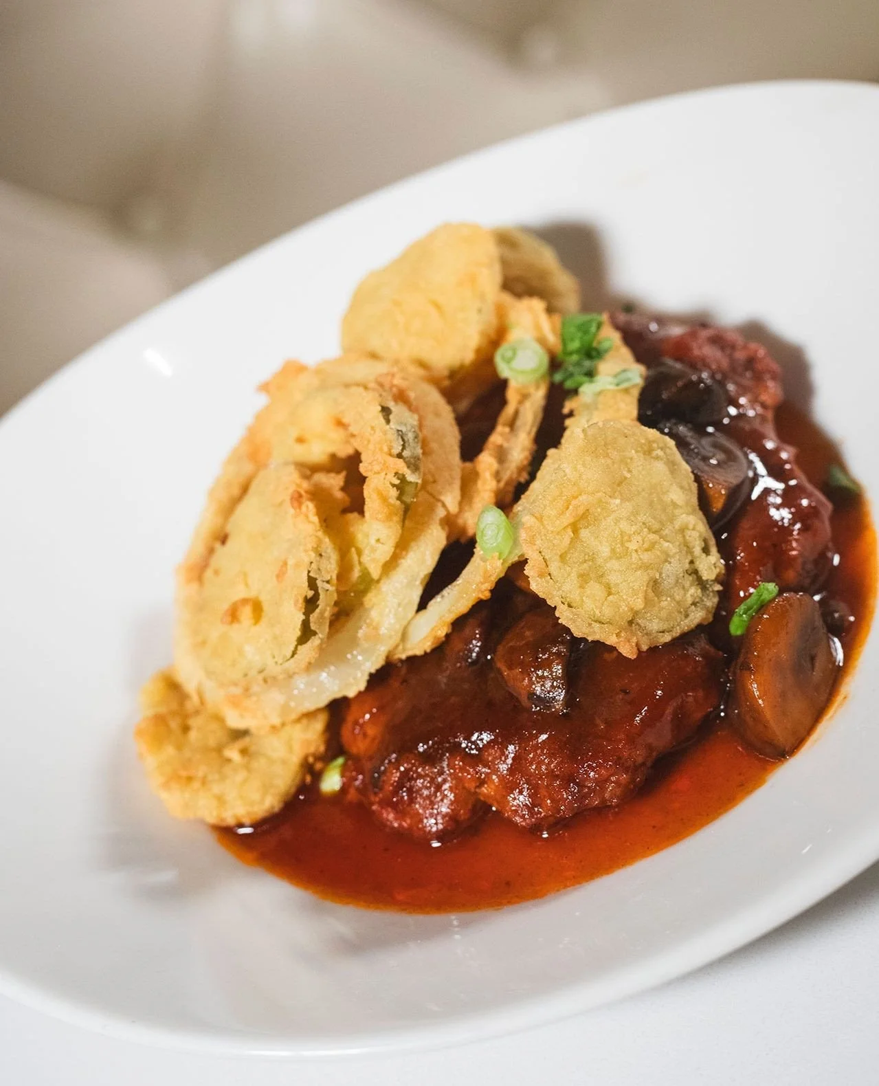 BBQ SALISBURY PORK STEAK⁠
smoked pimenton BBQ mushroom gravy, fried pickles and onions⁠
⁠
Worcester location only for a limited time!