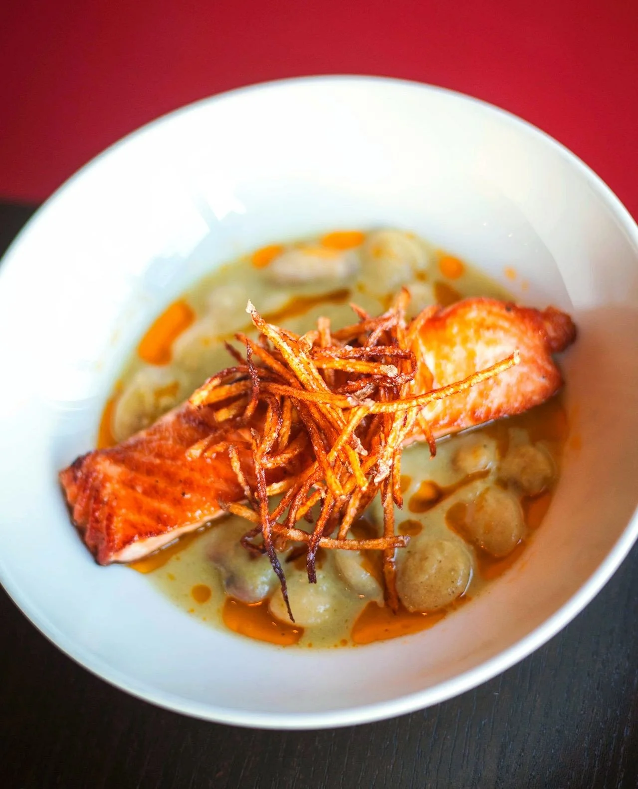 SEARED SALMON⁠
celery fennel bisque, butter beans, lemon annatto oil, potato hay⁠
⁠
Available tonight in Worcester and Wellesley!