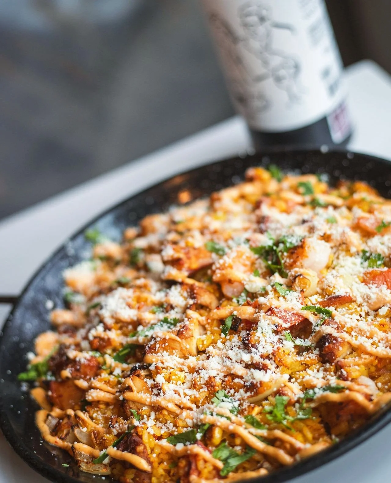 Back by popular demand! Our MEXICAN ELOTE PAELLA has officially returned to Bocado (at least for a little while) &mdash; loaded with chicken, shrimp, roasted corn, tomato, onion, and simmered in a rich chili cumin tomato broth, finished with fresh ci