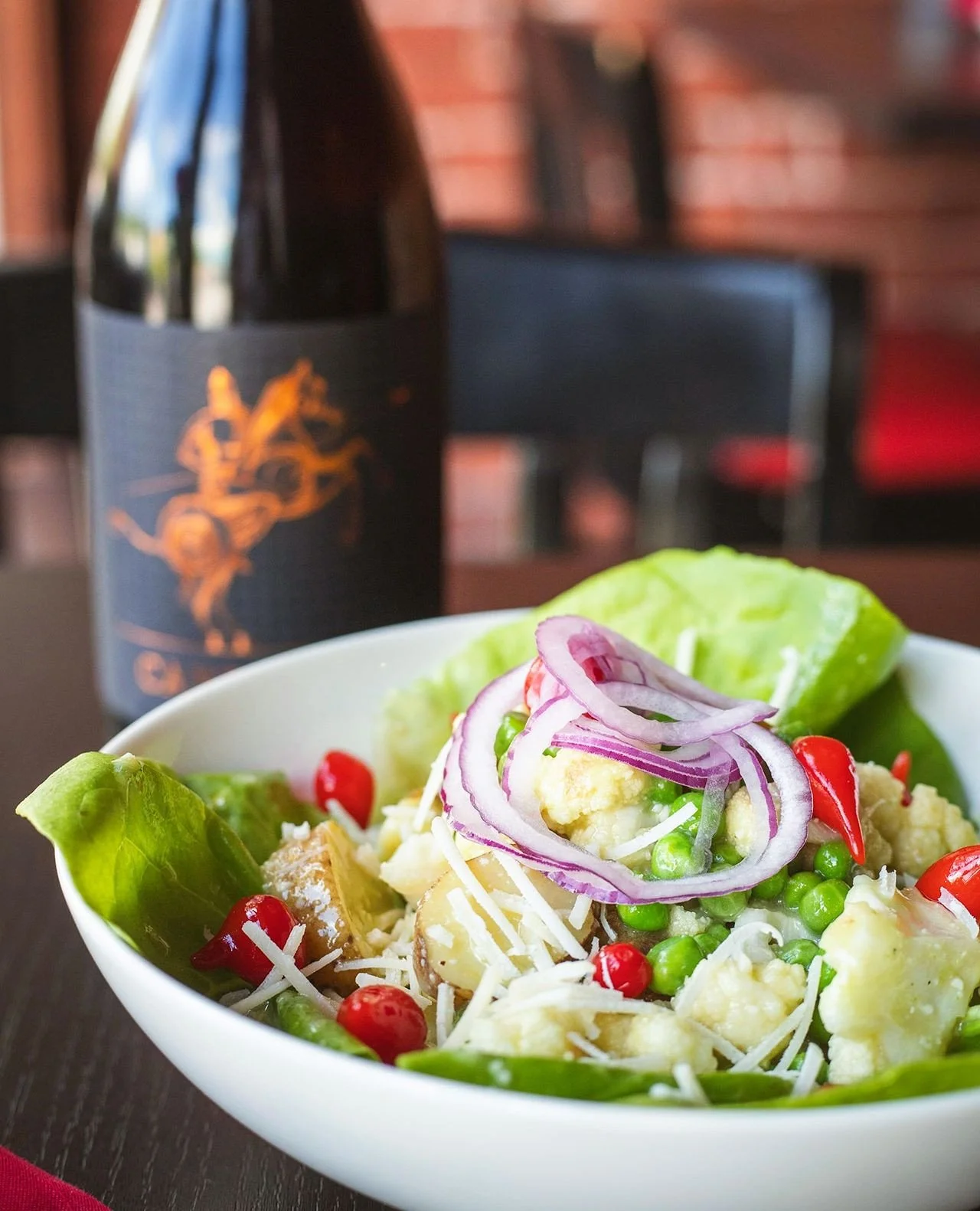 Our Bibb Lettuce &amp; Fingerling Salad brings together roasted cauliflower, spring peas, sweet drop peppers, red onion, and a bright green onion parmesan dressing for a dish that feels right at home on these warm spring nights.⁠
⁠
Available for a li