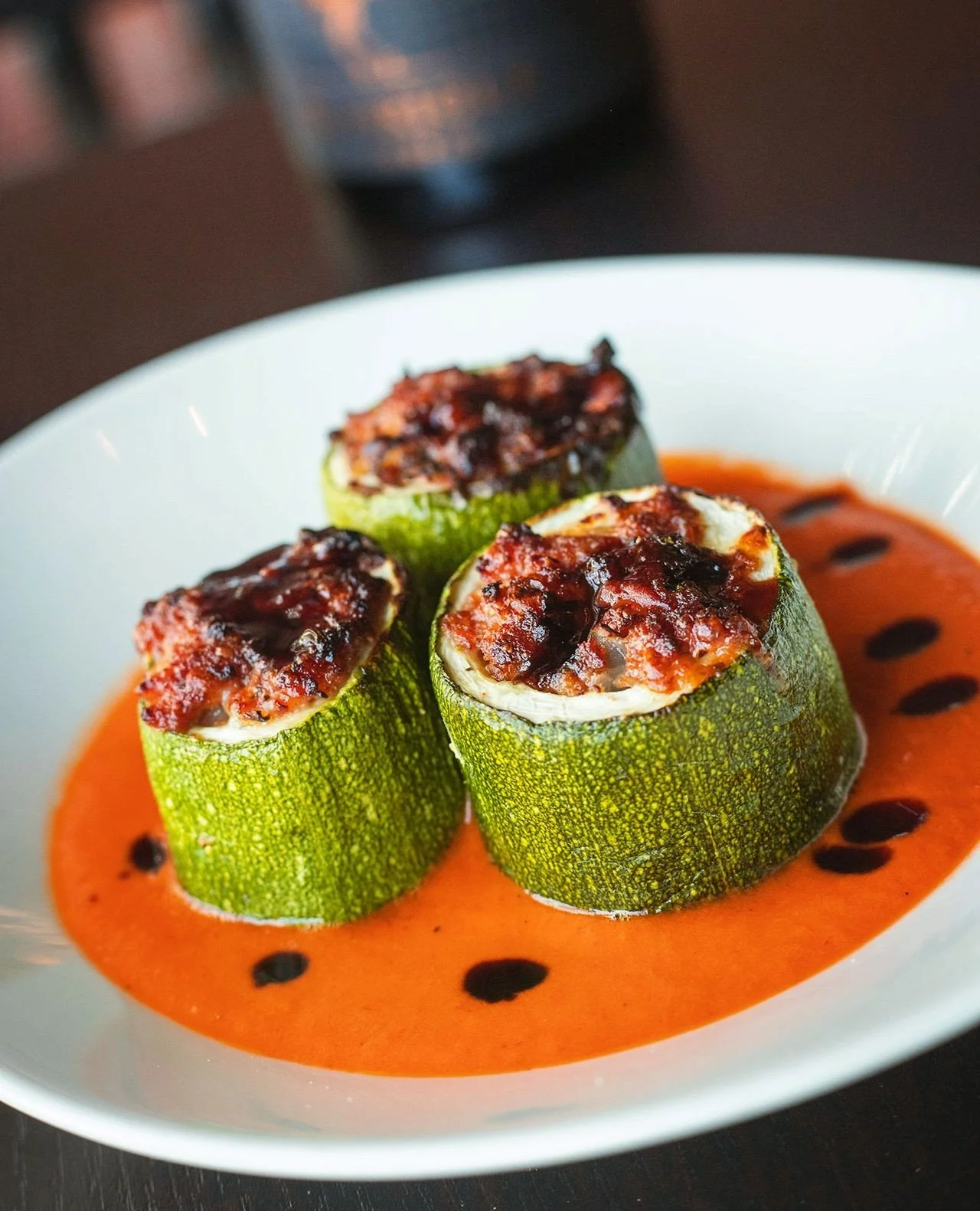 Beautiful as it is delicious. Chef's Stuffed Zucchini won't last forever, try it tonight in Worcester before our new specials drop &ndash; Portuguese linguica, fontina cheese, roasted red pepper sauce, port wine molasses