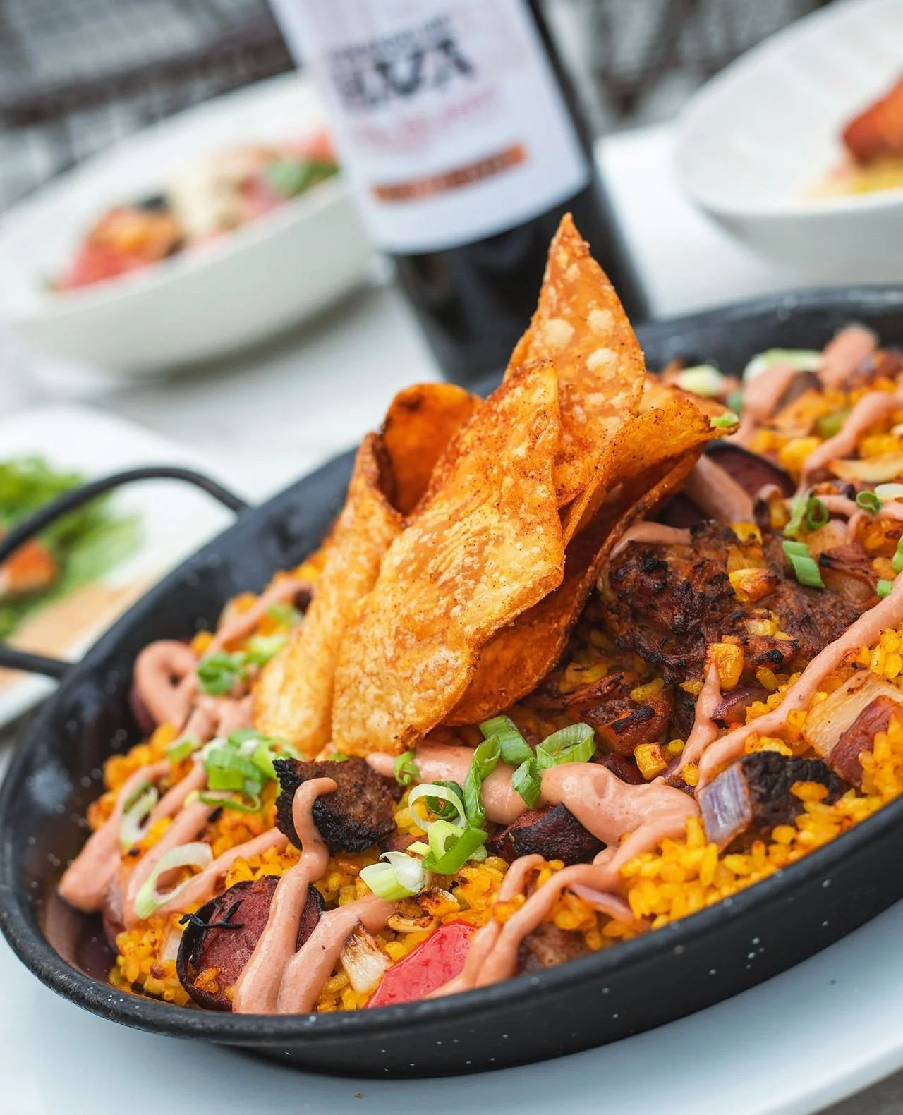 Paella purists, you may want to look away.⁠
⁠
Brisket. Pulled pork. Wagyu hot dog. BBQ crema. Potato chips. We took the backyard cookout and gave it the Bocado paella treatment.⁠
⁠
The Backyard BBQ Paella is still on the menu&mdash;but not forever.⁠
