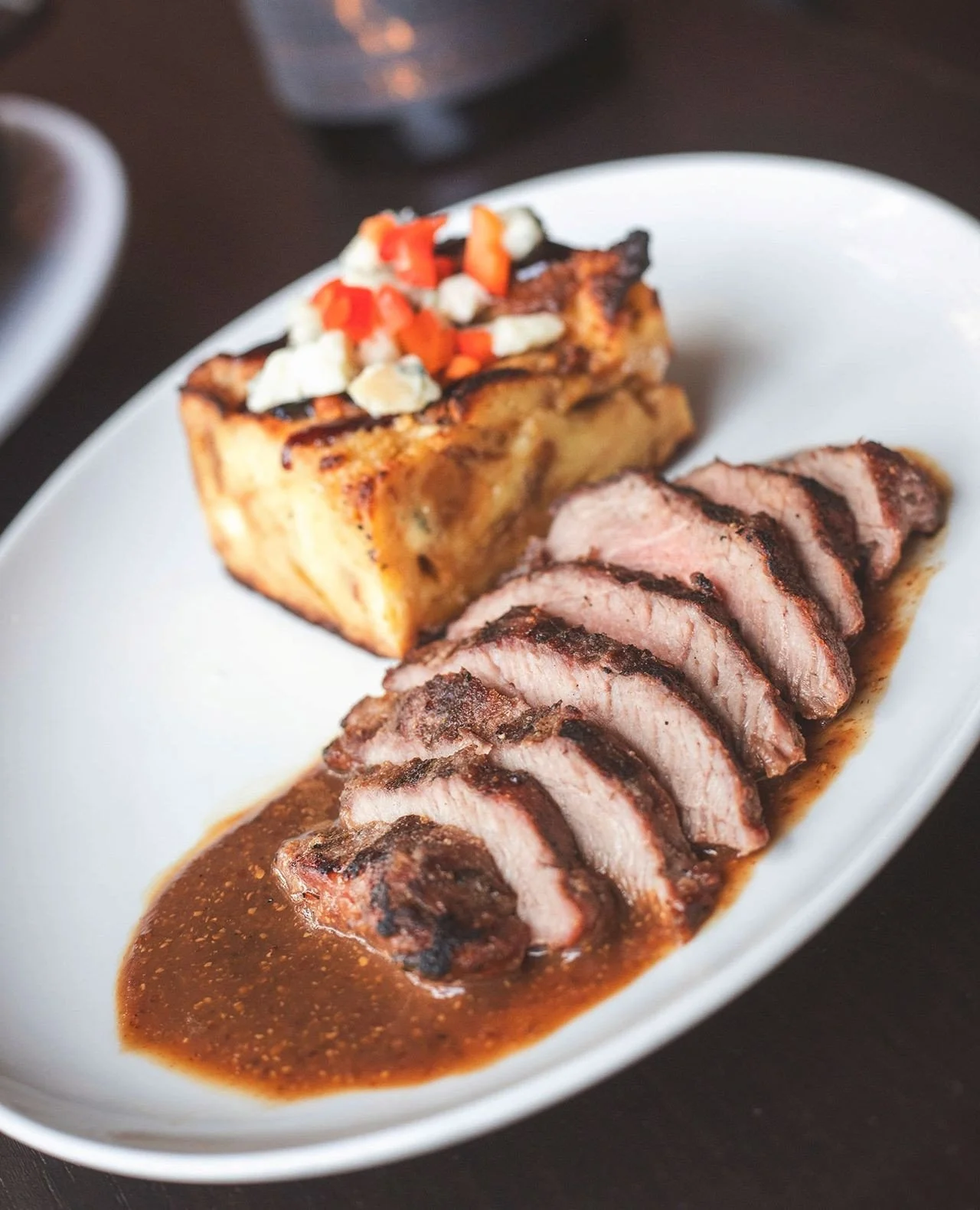The Spanish Iberico Pork Hanger Steak, another wine dinner standout, is paired with Moody bleu cheese &amp; caramelized onion strata and finished with a fig jam grain mustard glaze.⁠
⁠
Some dishes deserve more than one night in the spotlight. Availab