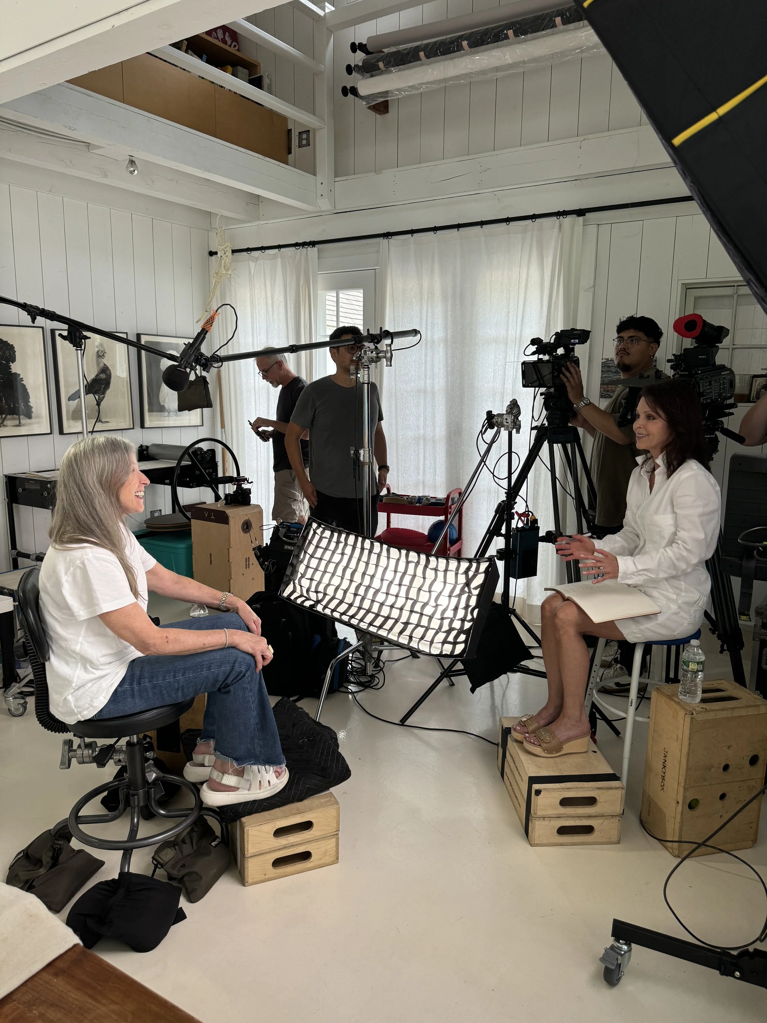 Cindy Sherman being interviewed by Sophie Chahinian with cameras and lights