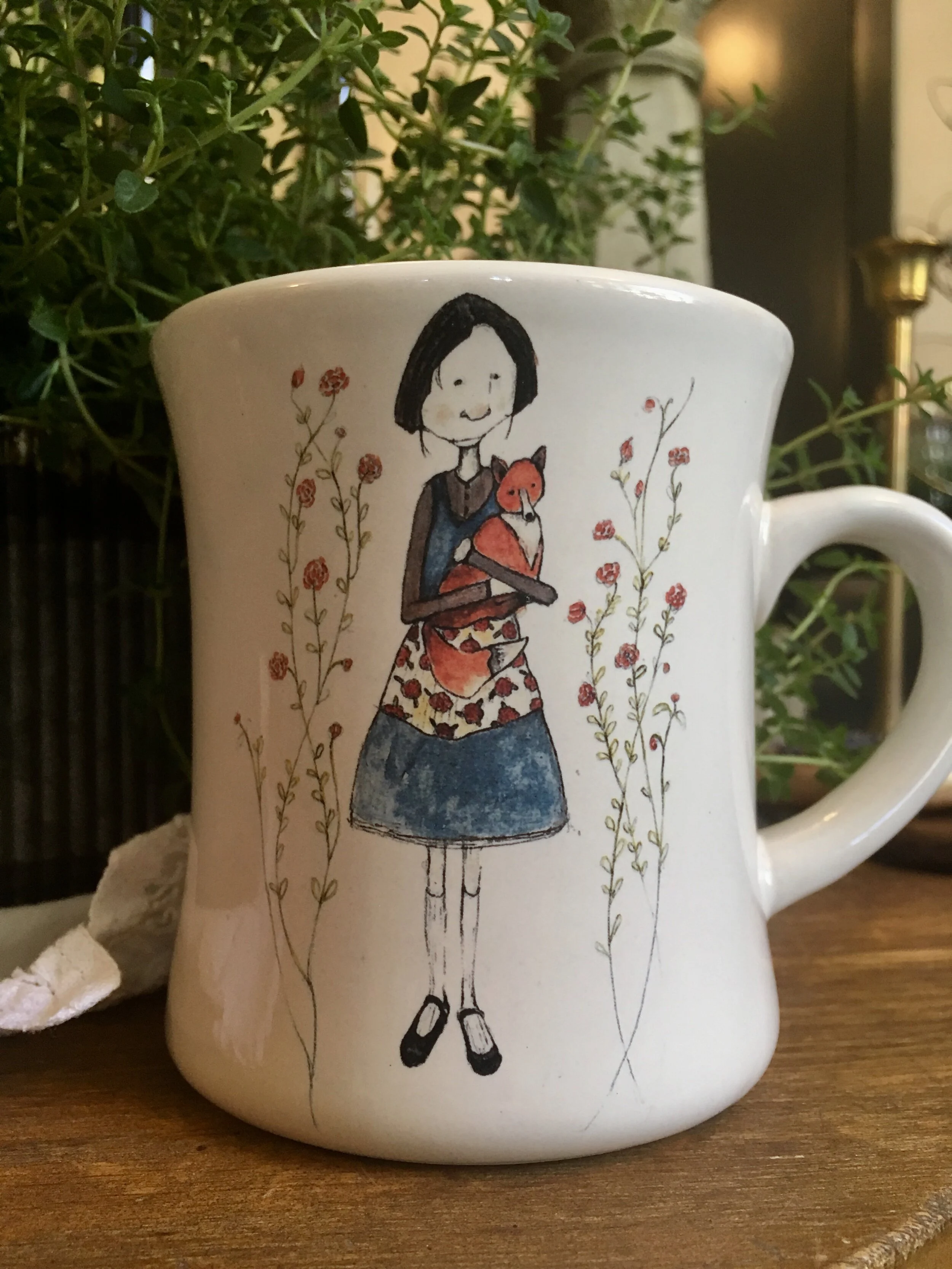 girl with fox mug.jpeg