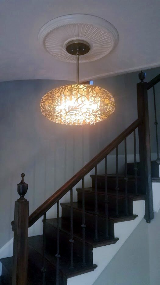 A new light fixture installed in the entryway