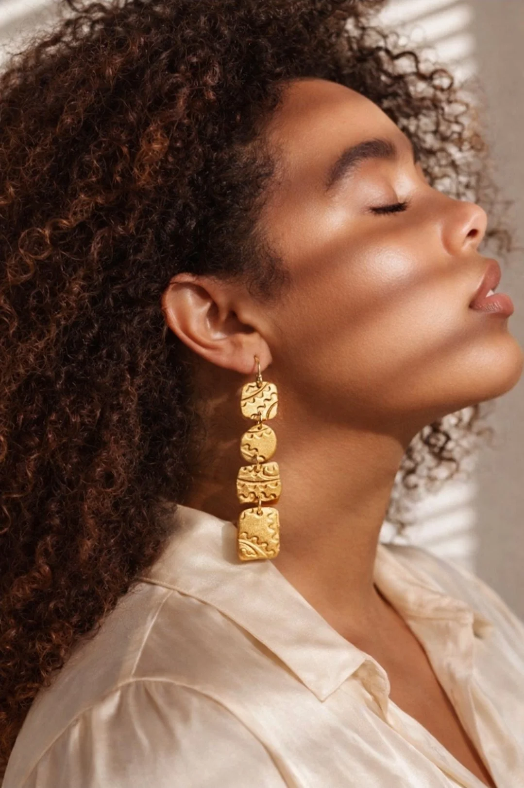 long gold clay earrings cascading design lightweight statement