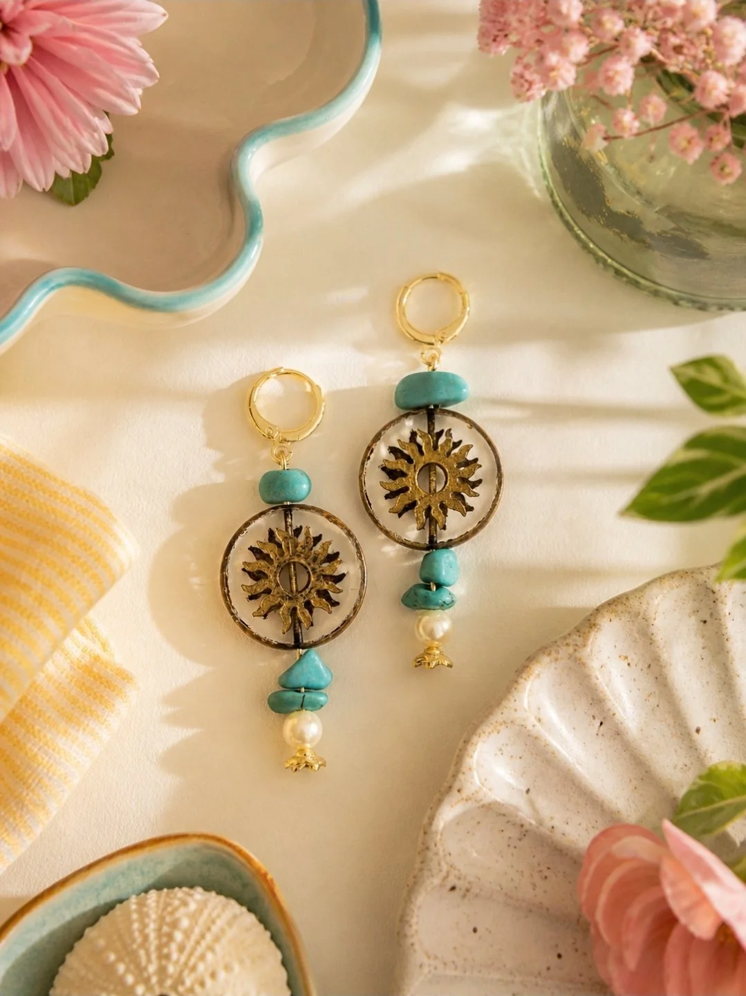 Hand beaded turquoise stone and pearl drop earrings with antiqued gold sun medallion charm on gold-plated huggie, by Akay Collective