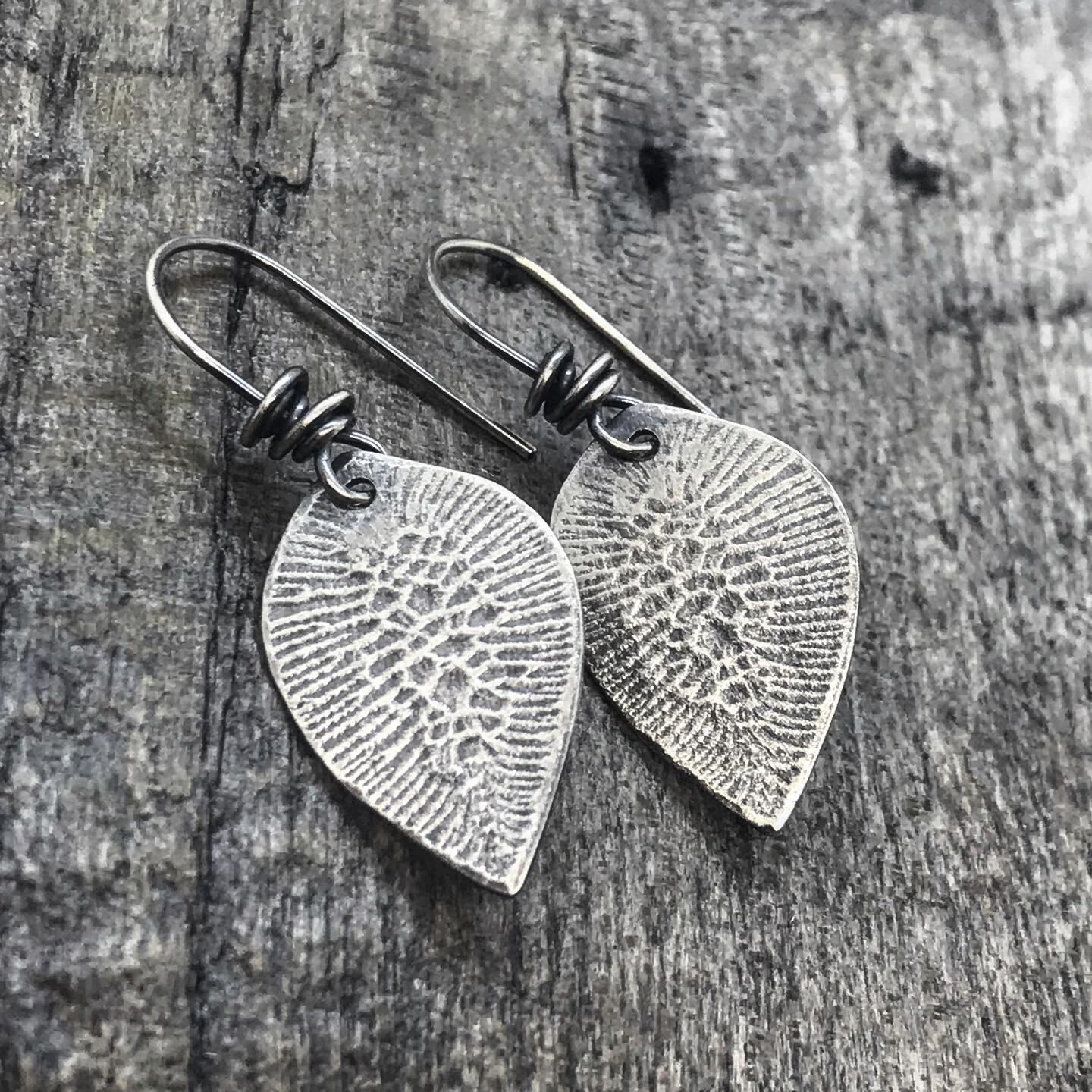 CB&amp;CO
.
Textured sterling silver teardrop earrings with sterling hand wrapped ear wires. 
$44
.
#sterling earrings #cracklepaint #handmade #MNmade #forsale #handcut #jewelerssaw #teardropearrings