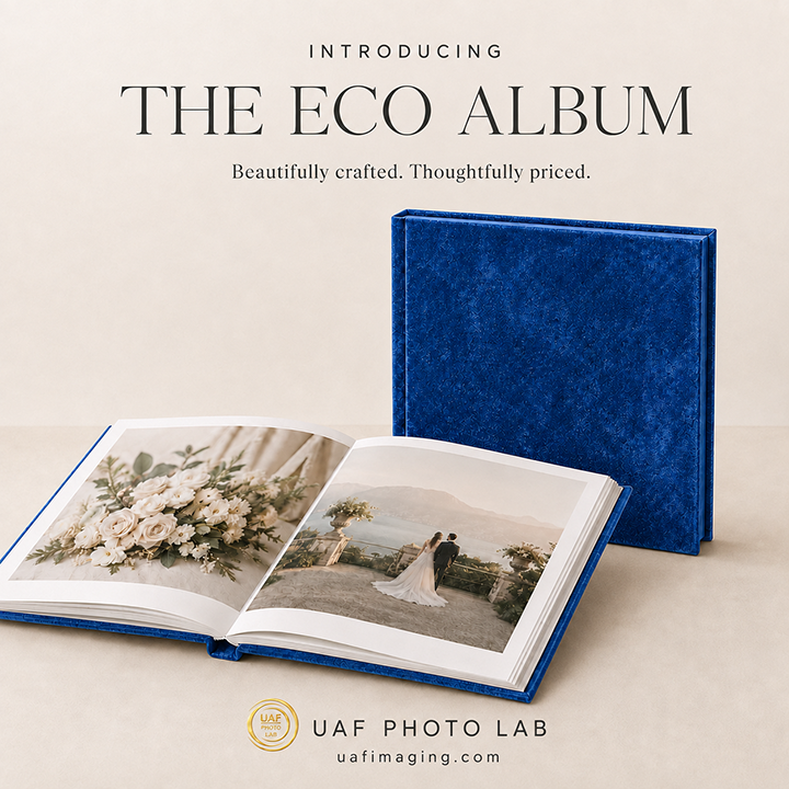 Open blue Eco Album displaying wedding photographs with matching blue cover