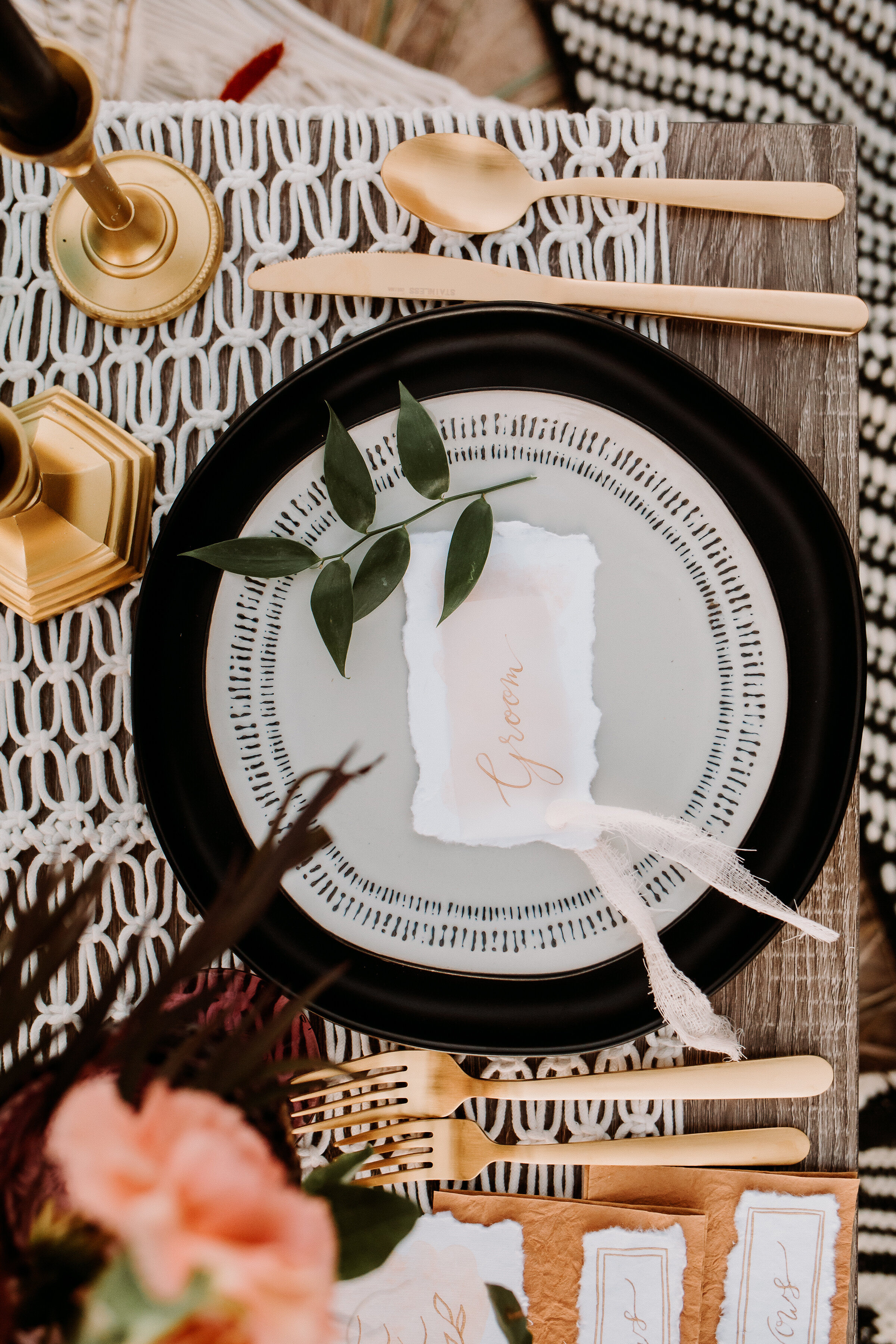  A look at the bohemian tablescape at this beachy styled shoot on the shore of lake michigan with boho table decor and hand-lettered place settings. chesterton indiana wedding photographer elopement midwest boho brides gold candlesticks boho hand-let