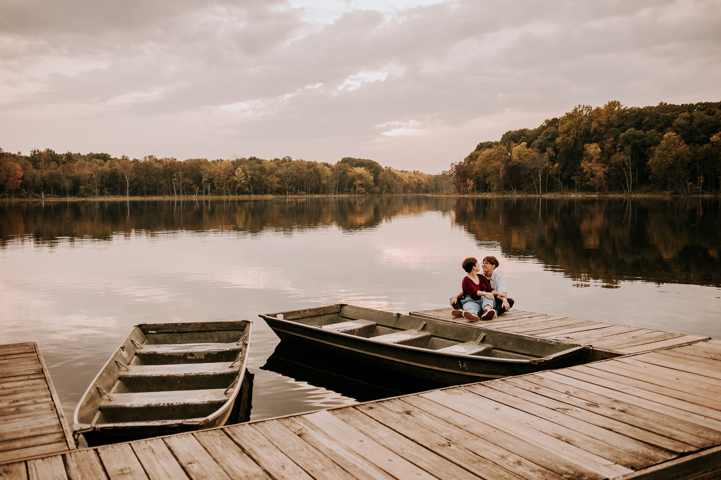  Beautiful Indiana photo location on a dock by a lake with boats with a same-sex couple wearing maroon and gray in by Kindred + Co. outdoor photoshoot locations in indiana lake with a dock and boats photoshoot locations same-sex couple engagements po