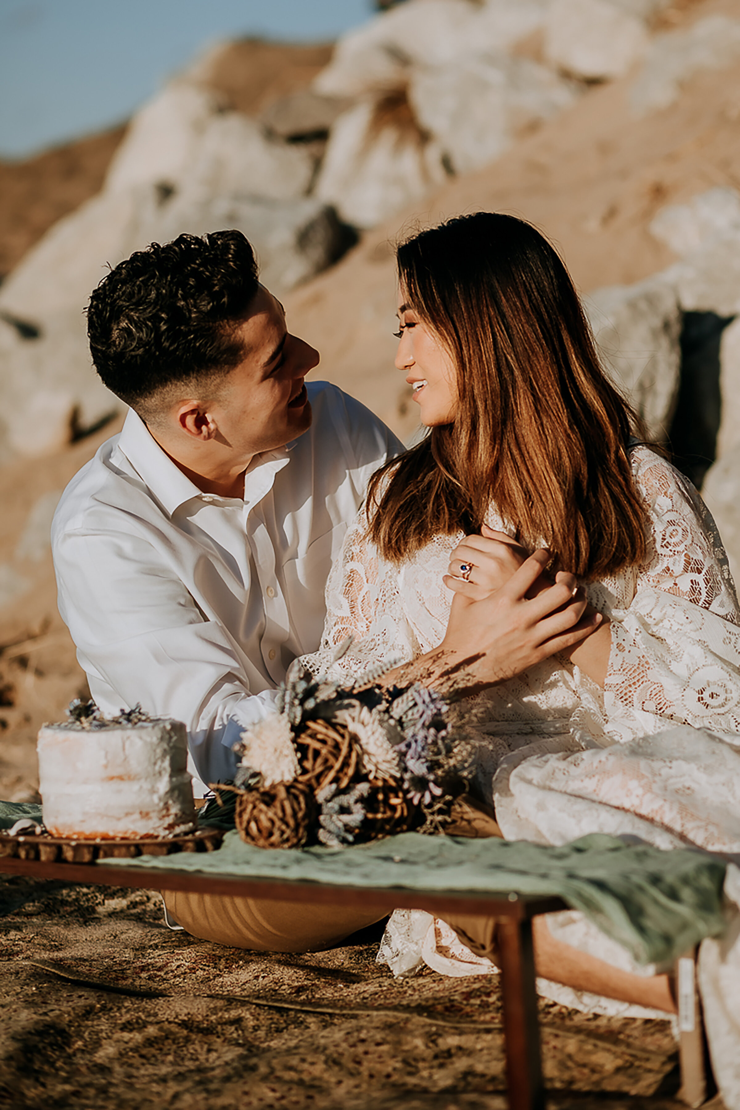  Pure in-the-moment happiness shot by Kindred &amp; Co. Photography in Ogden Dunes, Indiana after this couple’s elopement! bohemian styled elopement brown bronze smokey eye bridal makeup, crumb coated mini wedding cake, wedding picnic tray, professio