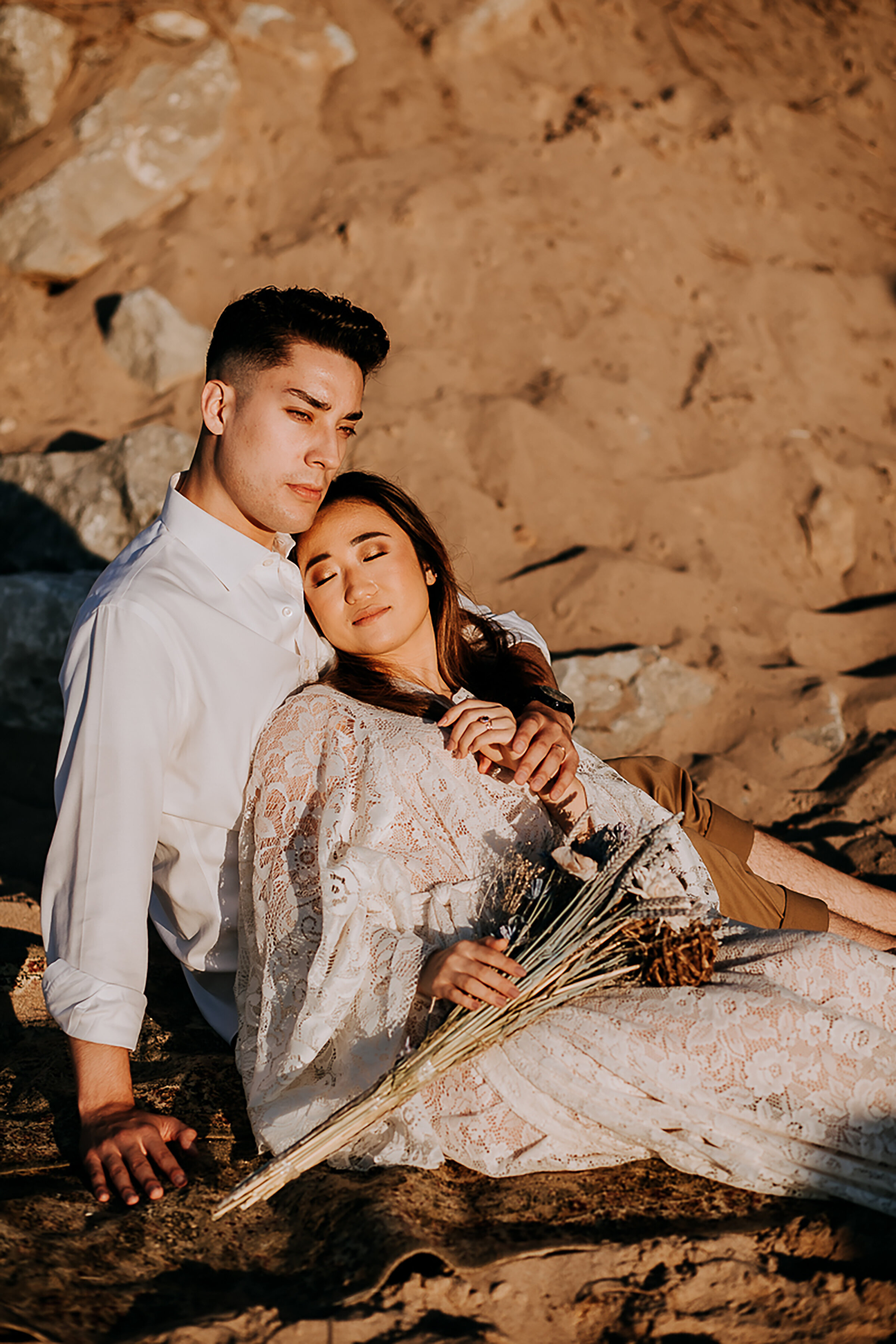  Kindred &amp; Co. Photography captures bride and groom cuddling on the shoreline on Indiana Dunes National Lakeshore. elopement celebration, elopement beach photos, professional chesterton indiana wedding photographer, elopement photographer chester