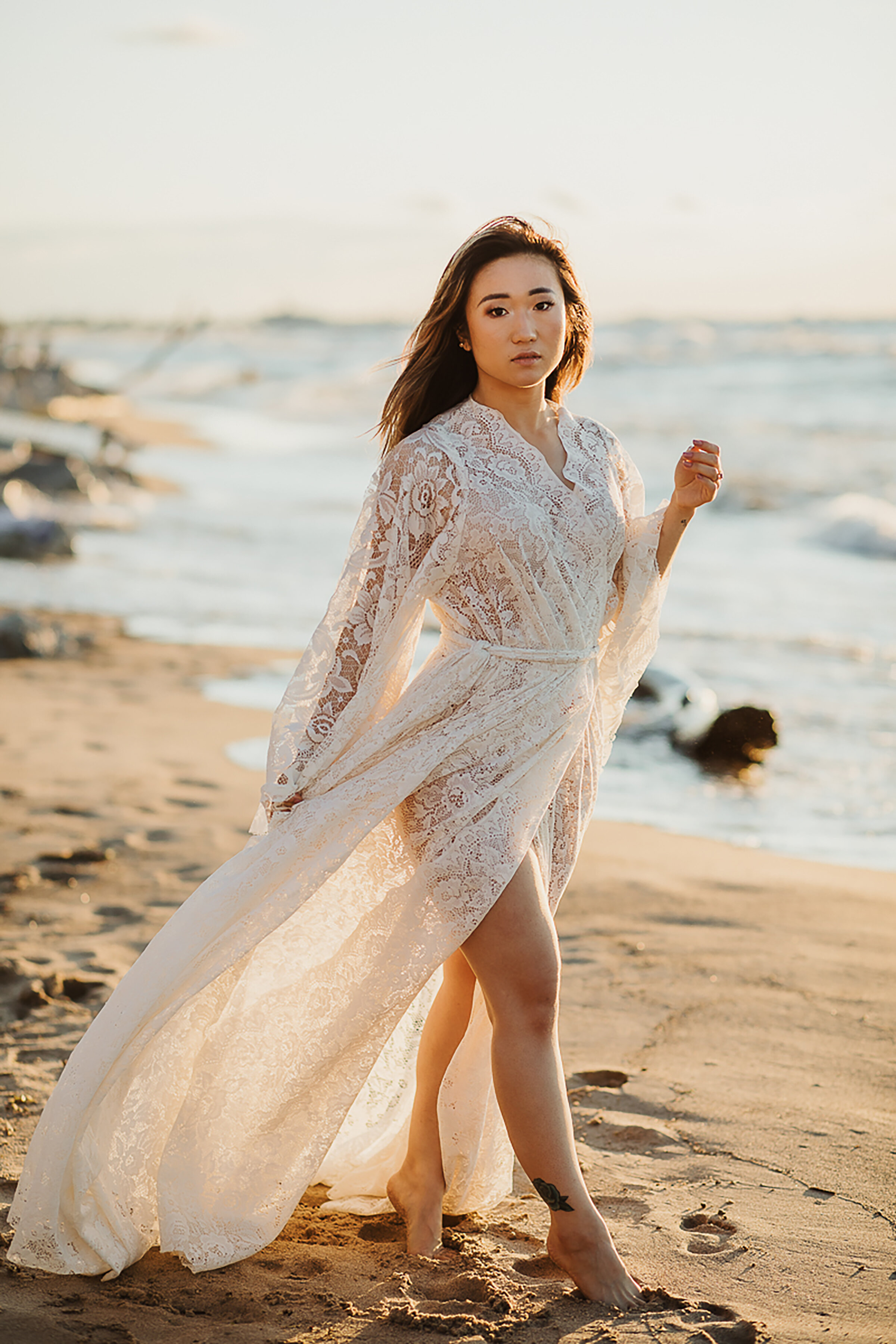  Kindred &amp; Co. Photography takes wedding portraits of elopement bride wearing bohemian styled lingerie attire on Indiana Dunes National Lakeshore. bell sleeved bohemian lingerie, long flowy laced beach dress, bohemian styled elopement, profession