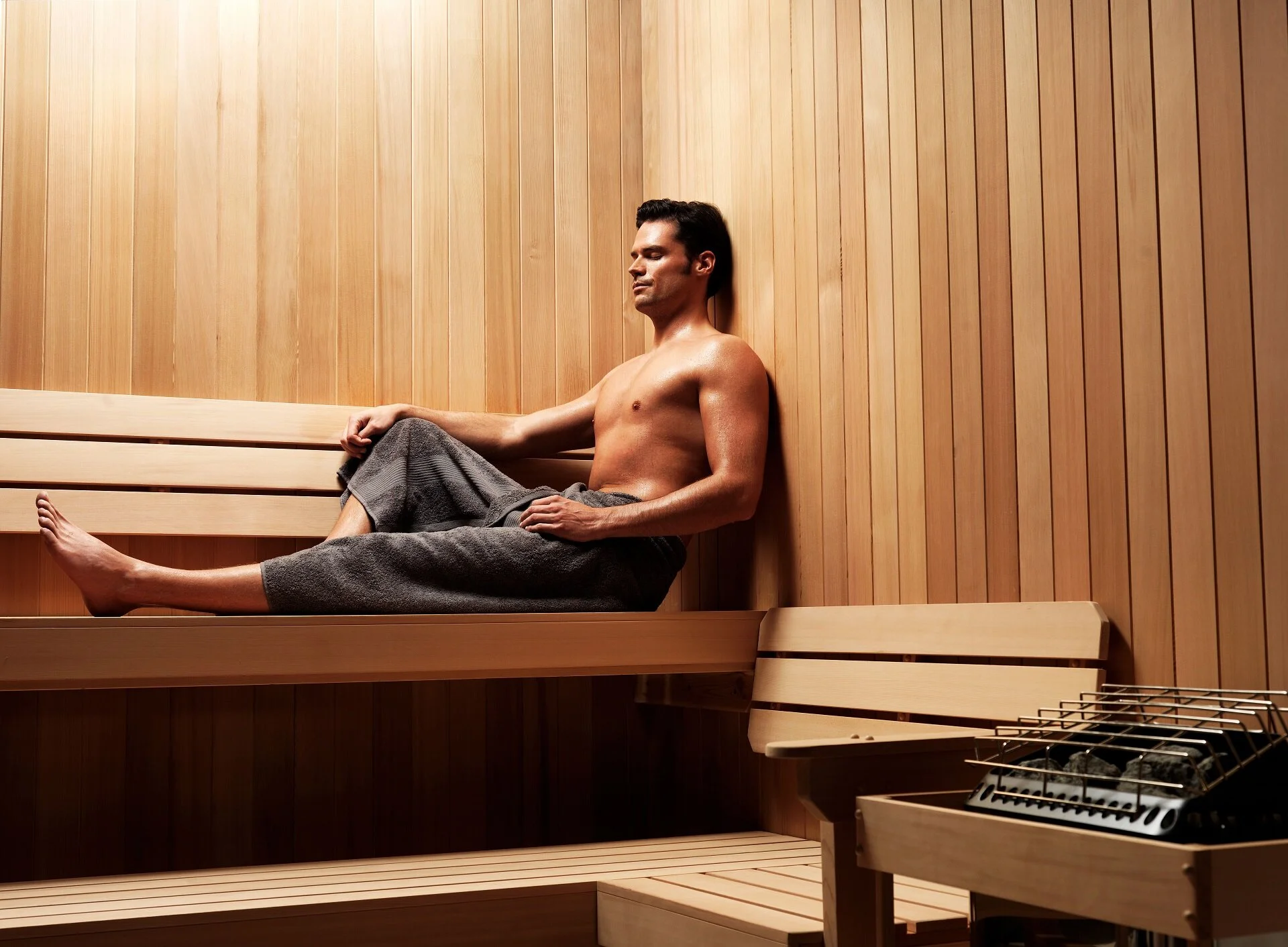 Amerec-Sauna---Man-reclining-on-upper-bench 2.jpg