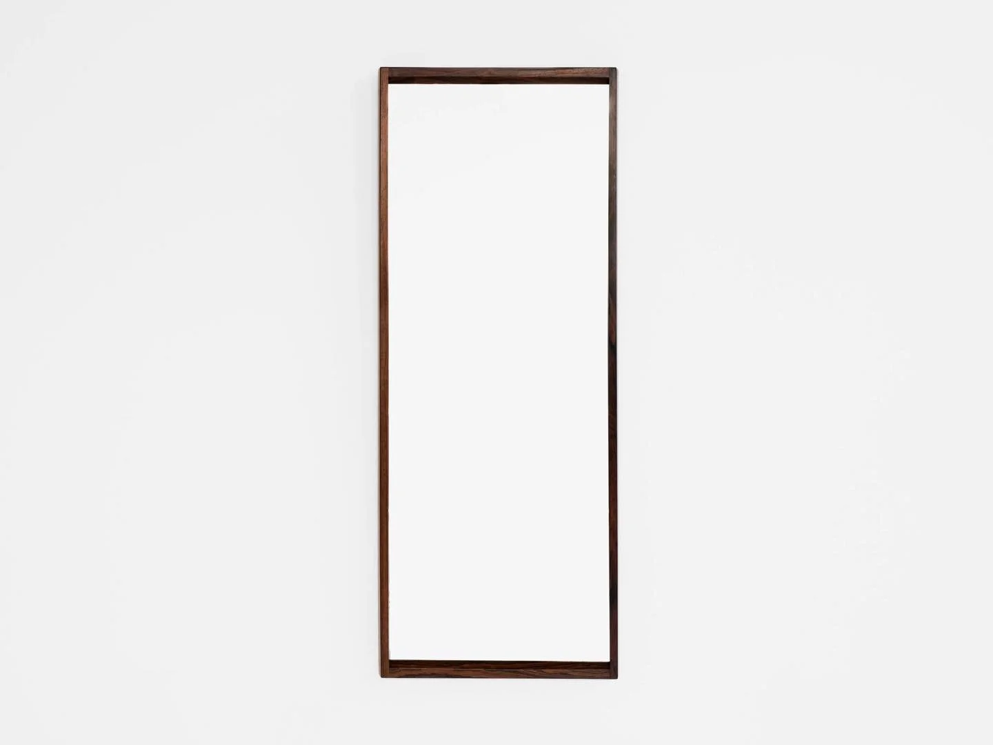 Midcentury Danish mirror in rosewood by Kai Kristiansen for Aksel Kjersgaard 1960s

This mirror is designed by Kai Kristiansen and manufactured by Aksel Kjersgaard in Denmark in the 1960s. It is refined in every detail. Top quality by Aksel Kjersgaar