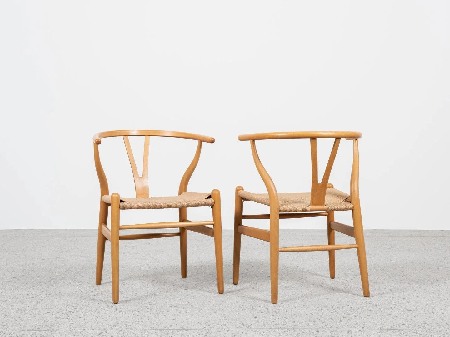 Midcentury pair of original Wishbone Chairs by Hans Wegner for Carl Hansen &amp; S&oslash;n

This pair of original Wishbone chairs is designed by Hans Wegner in 1949 and manufactured by Carl Hansen &amp; S&oslash;n in Denmark in the 1960s. There is a
