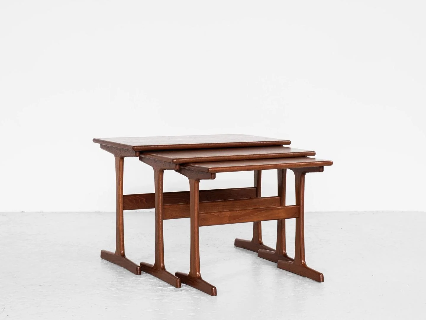 Midcentury Danish nest of 3 side tables in teak by Kai Kristiansen for Vildbjerg

This nest of 3 side tables is designed by Kai Kristiansen and manufactured by Vildbjerg M&oslash;belfabrik in Denmark in the 1960s. There is a logo stamped by the manuf