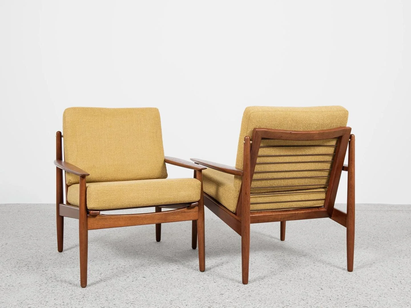 Midcentury Danish pair of easy chairs in teak by Arne Vodder for Glostrup 1960s

This pair of easy chairs is designed by Arne Vodder and manufactured by Glostrup in Denmark in the 1960s. There is an old label by the manufacturer. The design stands ou