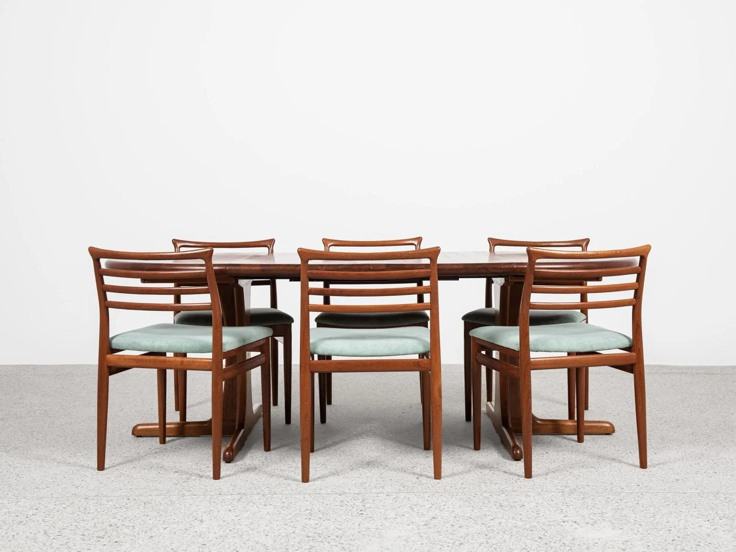 Midcentury Danish round teak dining table with 2 extensions 1960s - central leg

This round dining table is designed and manufactured in Denmark in the 1960s. We don&rsquo;t know the manufacturer. There is a &lsquo;Made in Denmark&rsquo; stamp under 