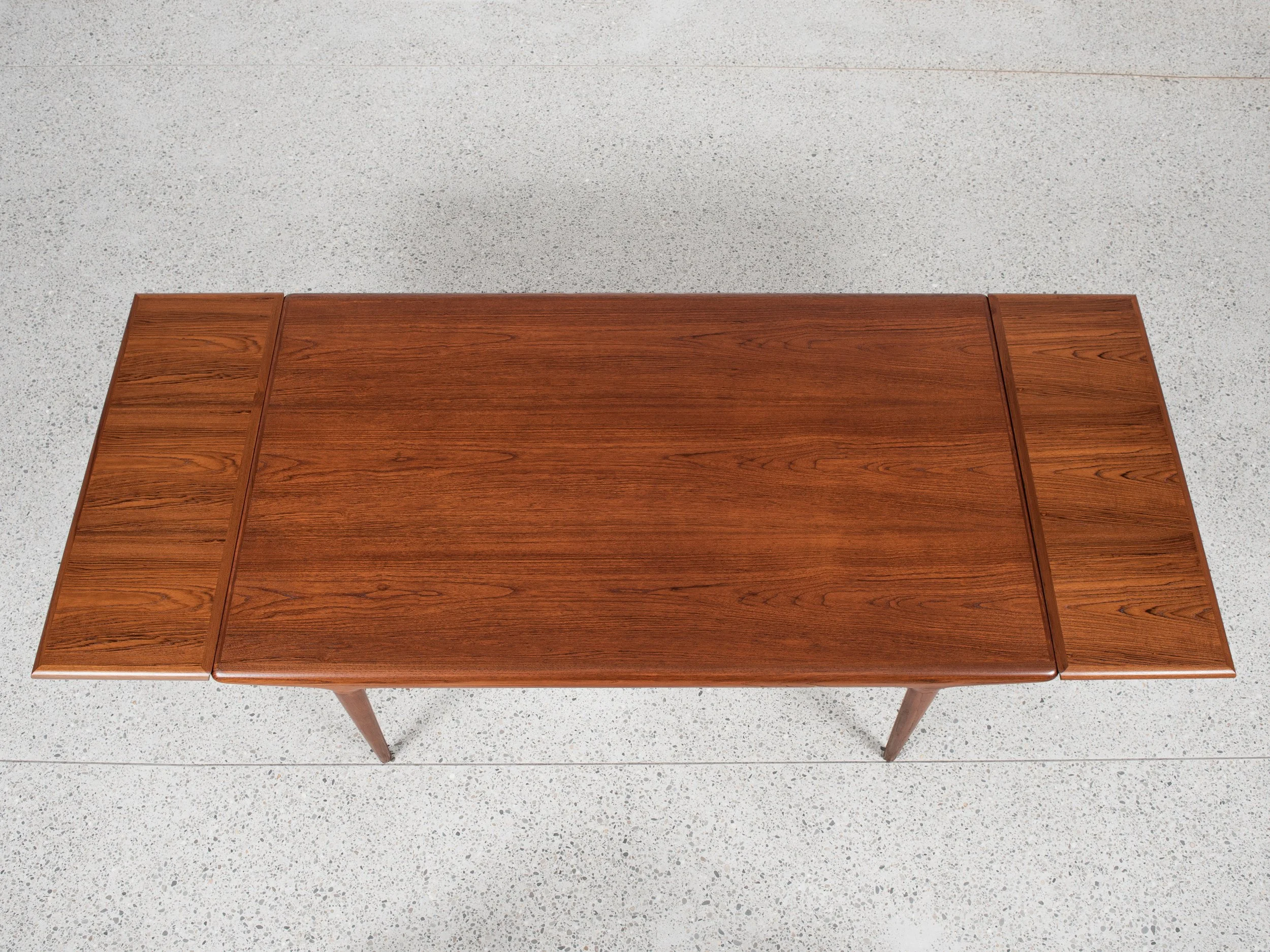 Midcentury extendable Danish dining table in teak by Niels Otto 
