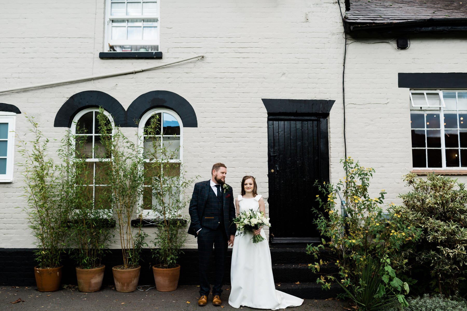 A bride and groom wedding portrait at Burley Manor in the New Forest