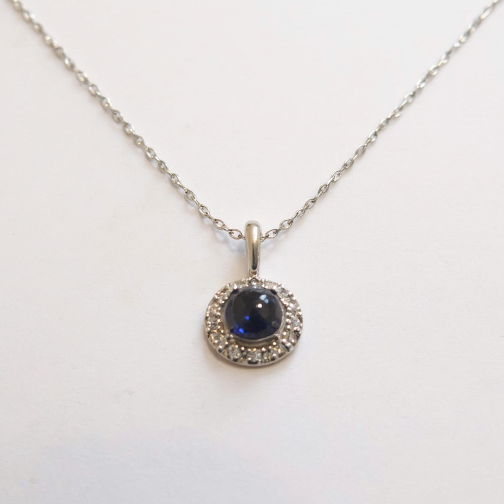 Make the silver necklace shinier, make the sapphire more brilliant, and replace the background with a bright one.png