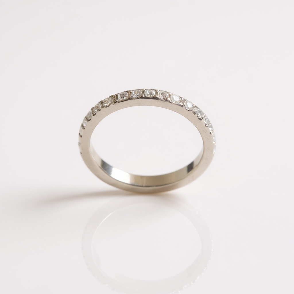 Make the silver ring look like a professional product photography image with a bright background.png