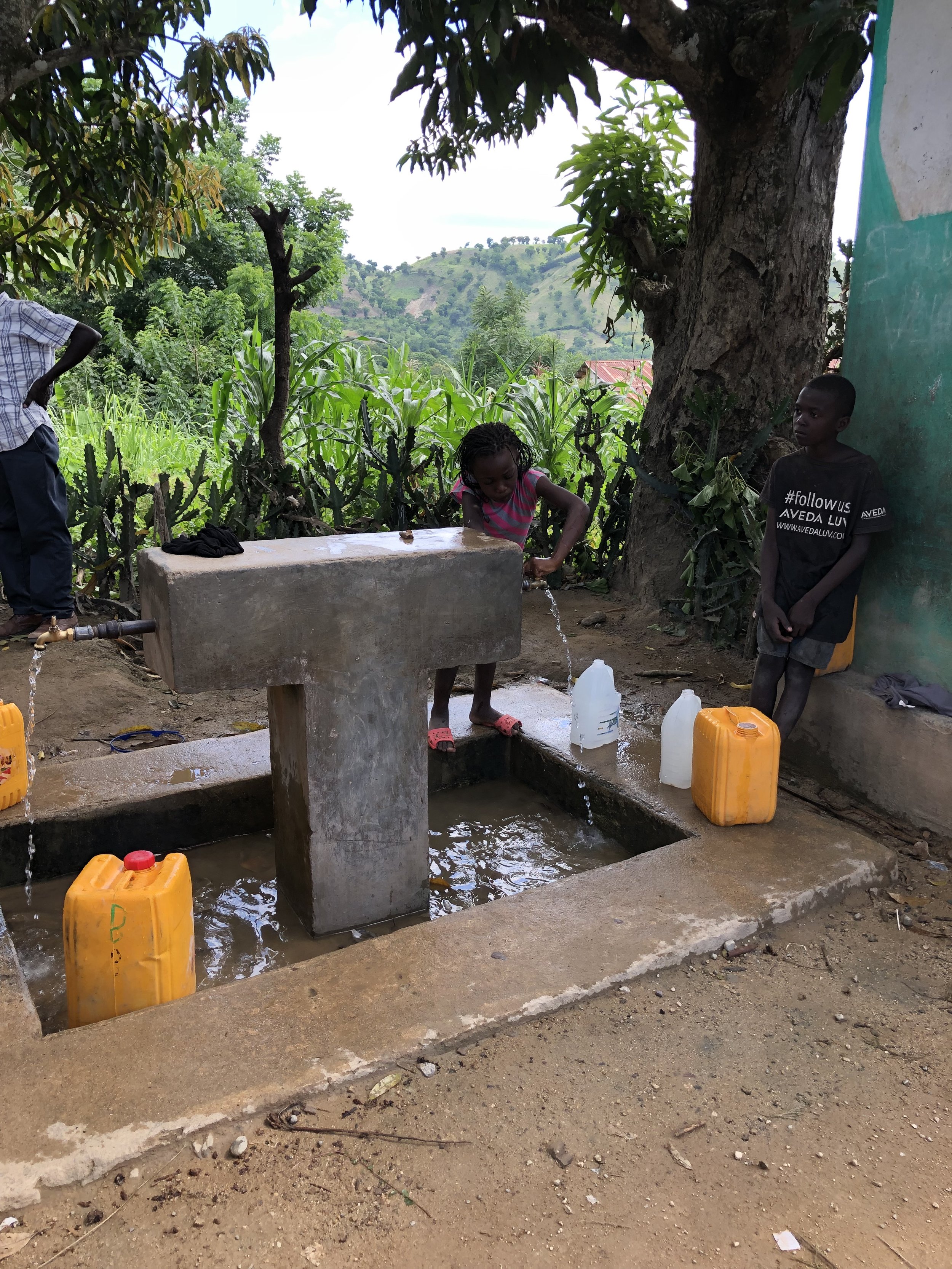 filling water from cistern - Haiti.JPG