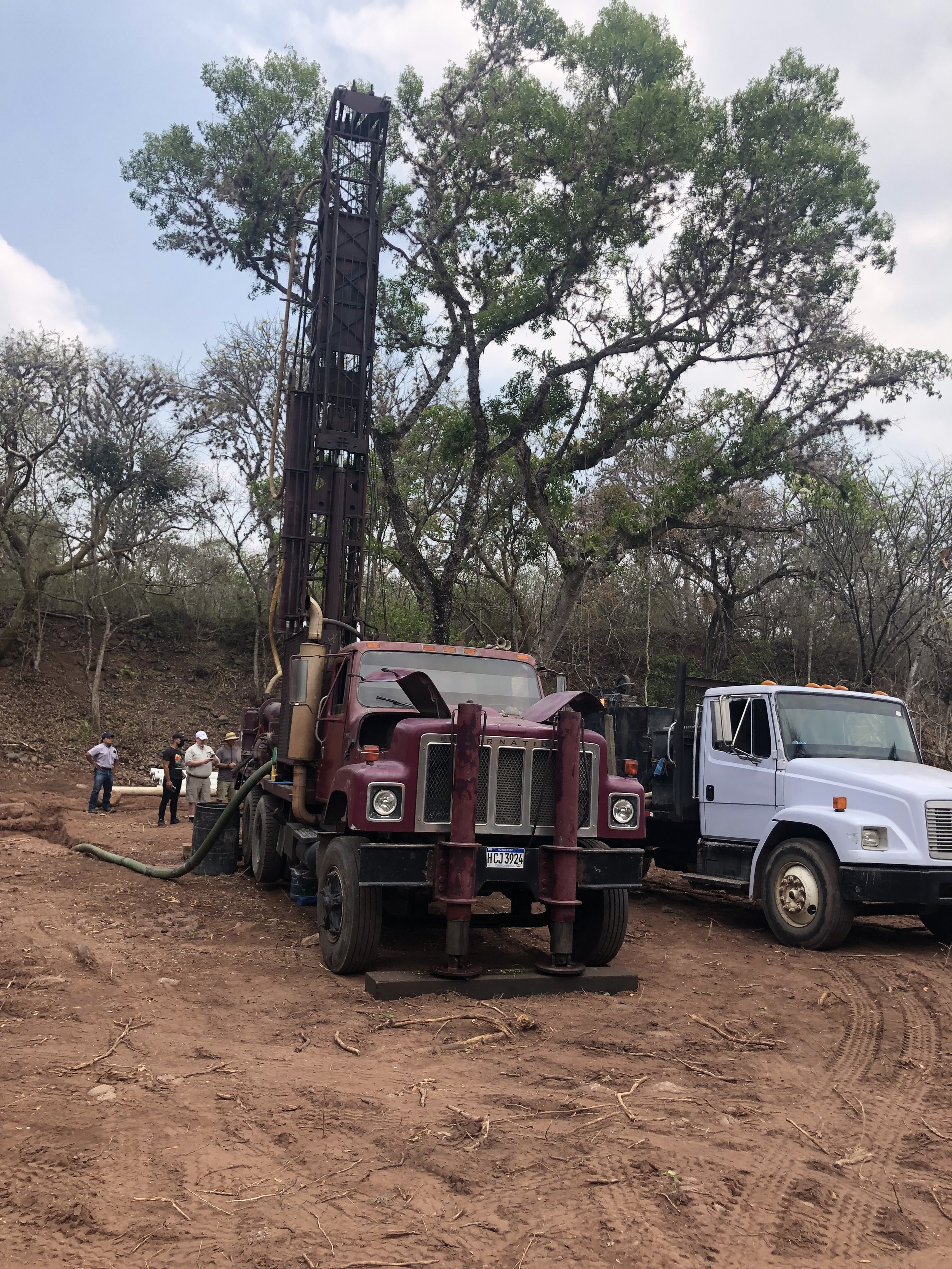 Front shot of drilling rig & truck with mud.jpg