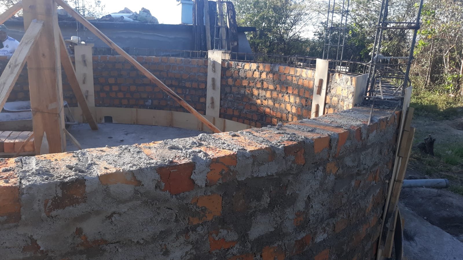 about half of bricks in place - wall is growing.jpeg