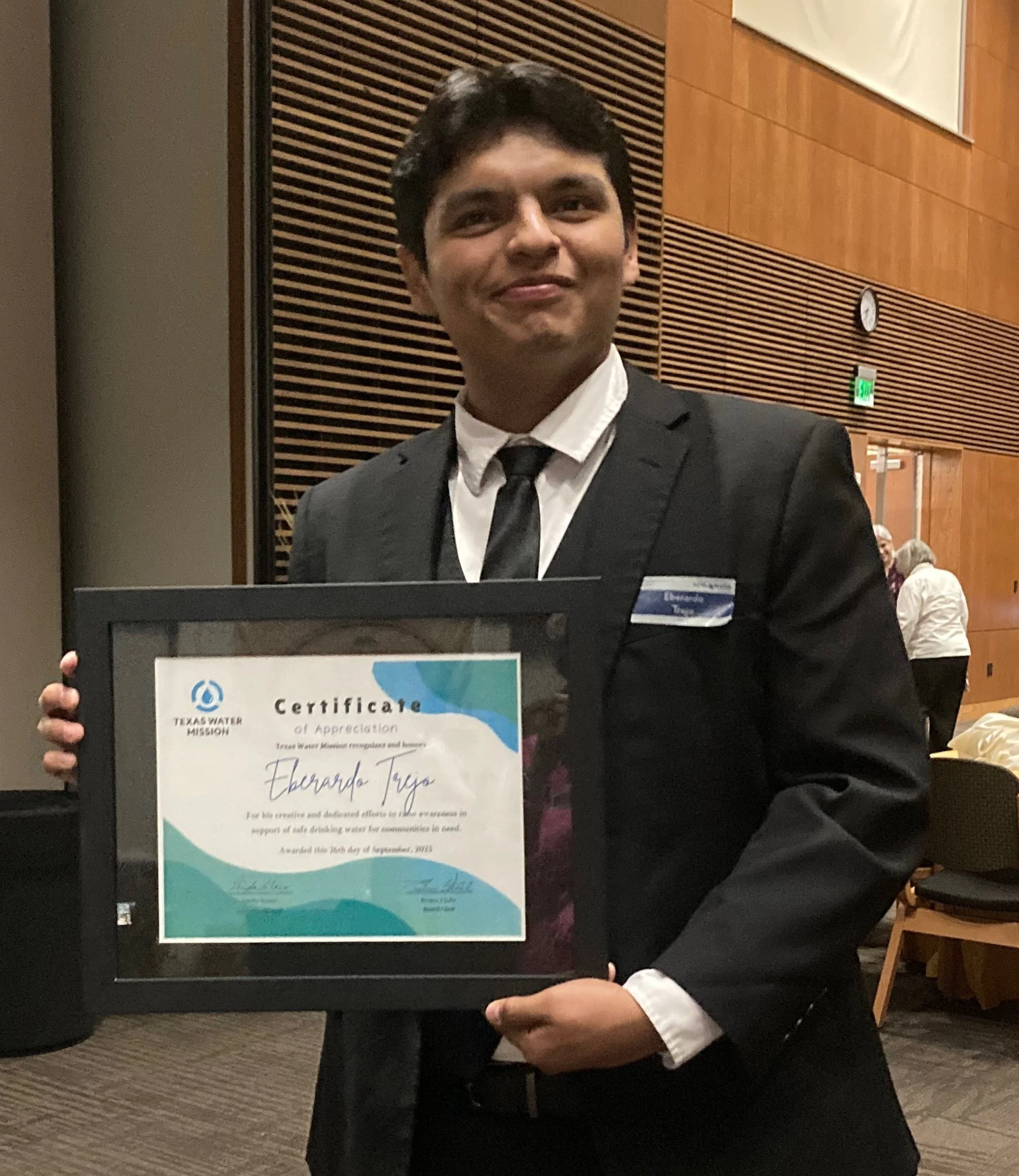 Eber smiling holding plaque.jpeg