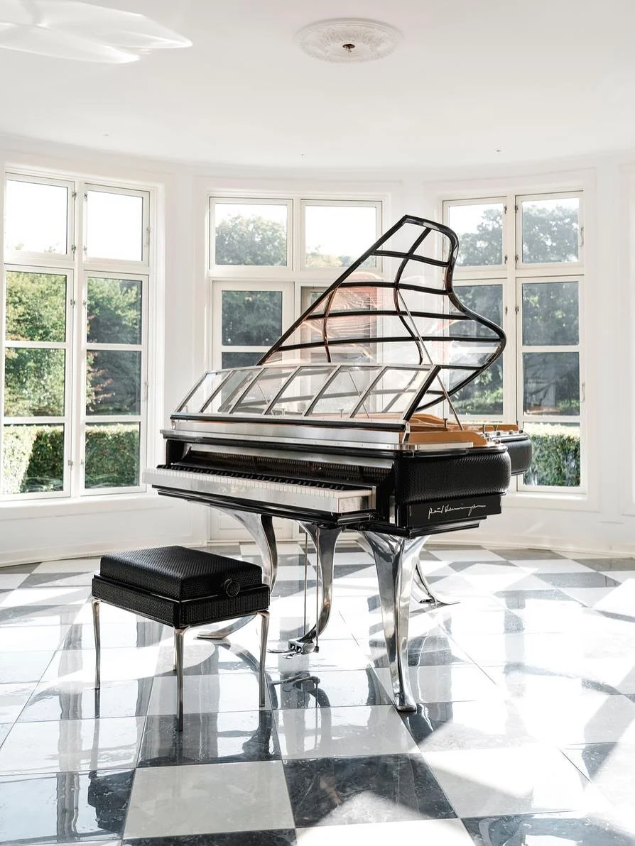 Elegant and eye-catching, this PH Grand Piano has woven leather banding around the circumference of the instrument.⁠
⁠
Every handcrafted PH Grand Piano can be configured to suit the setting and aesthetic of its space. The PH Grand Piano comes in a fu