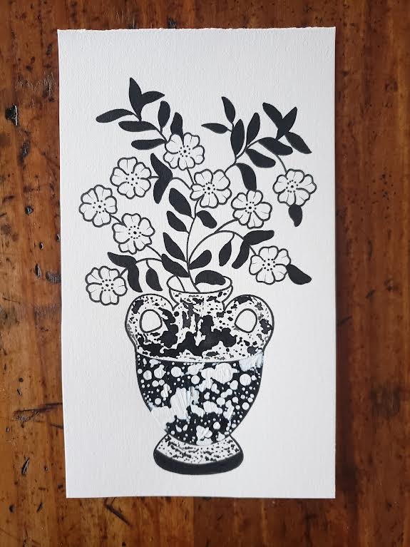 flowers in a splatter jug