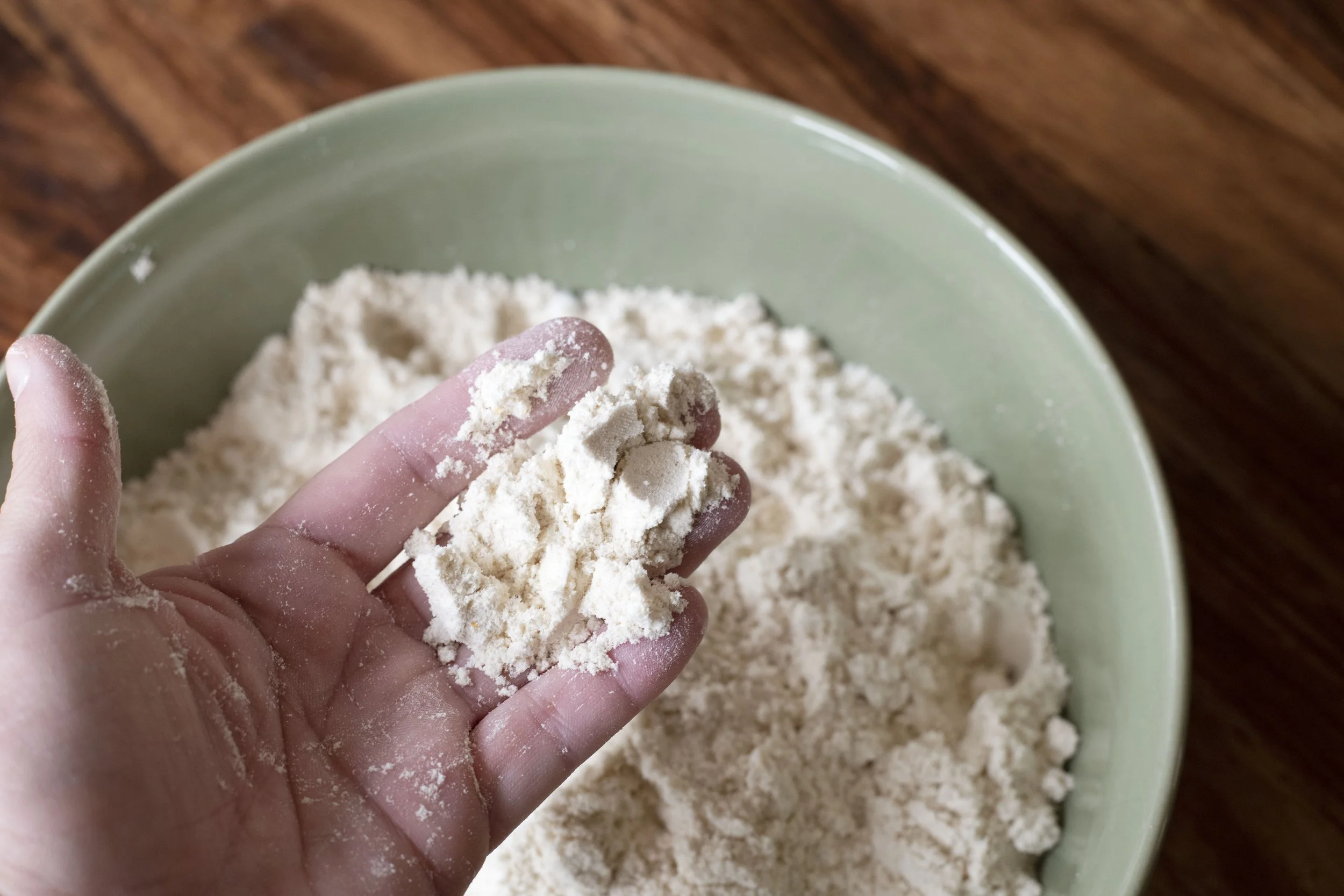 Masa Harina flour in an open palm hand