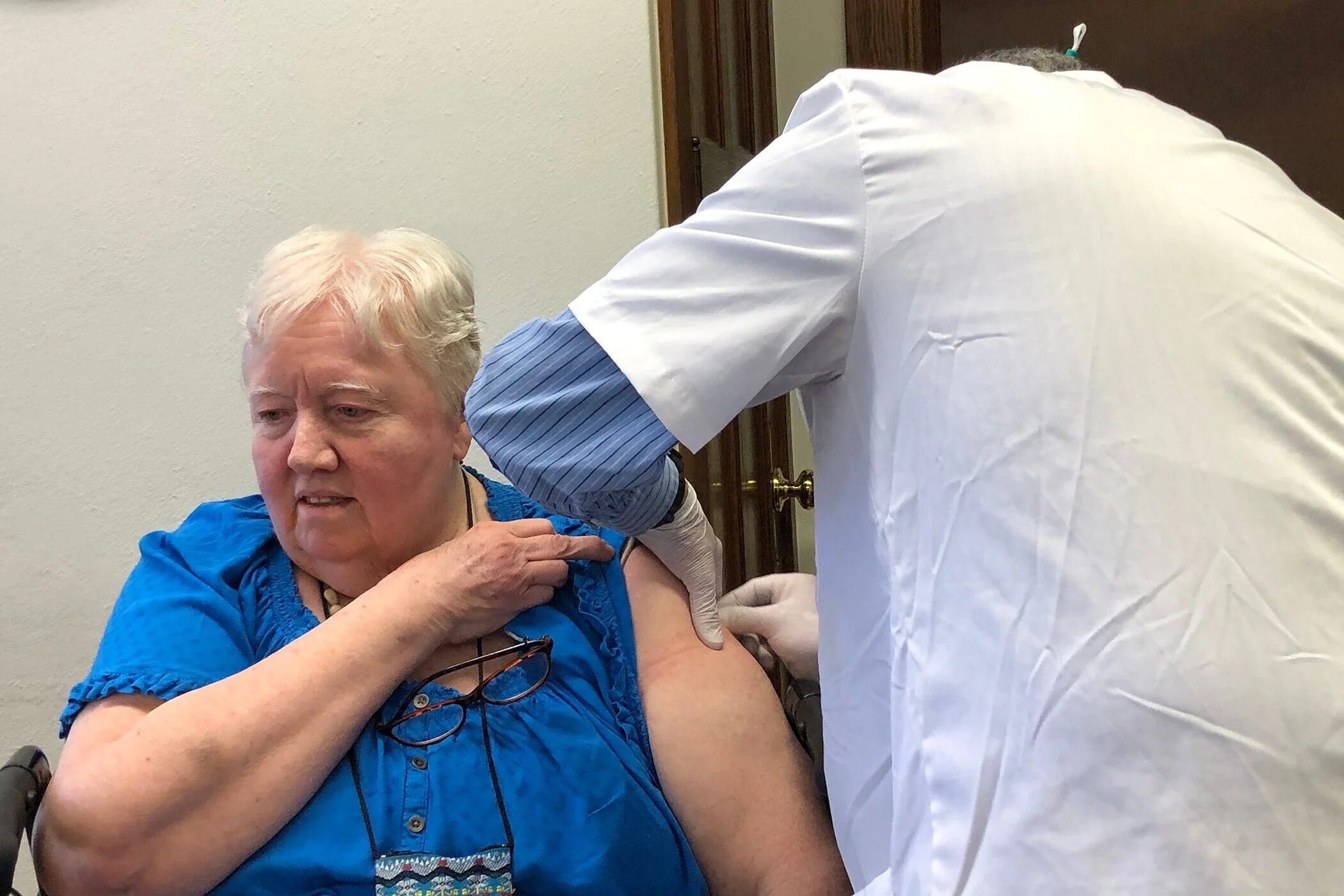 Sister Virginia Rose Carroll, a resident of Antonia Hall, receives her COVID-19 vaccine.